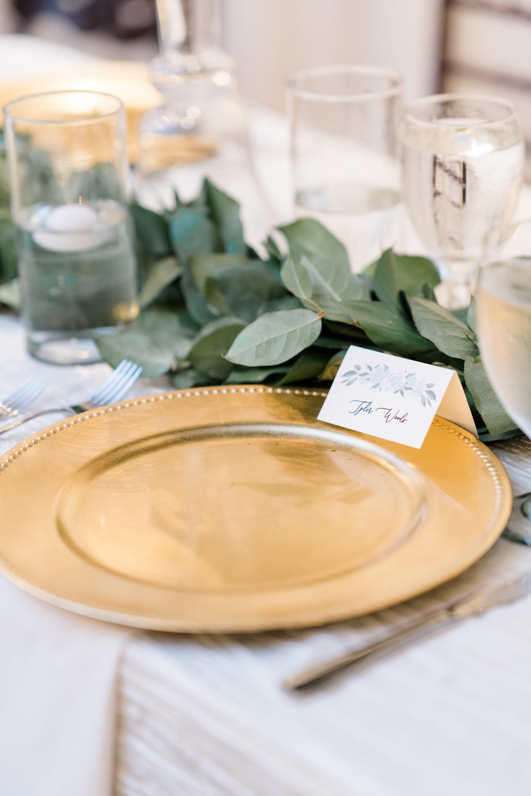 place setting with gold plate and placard 