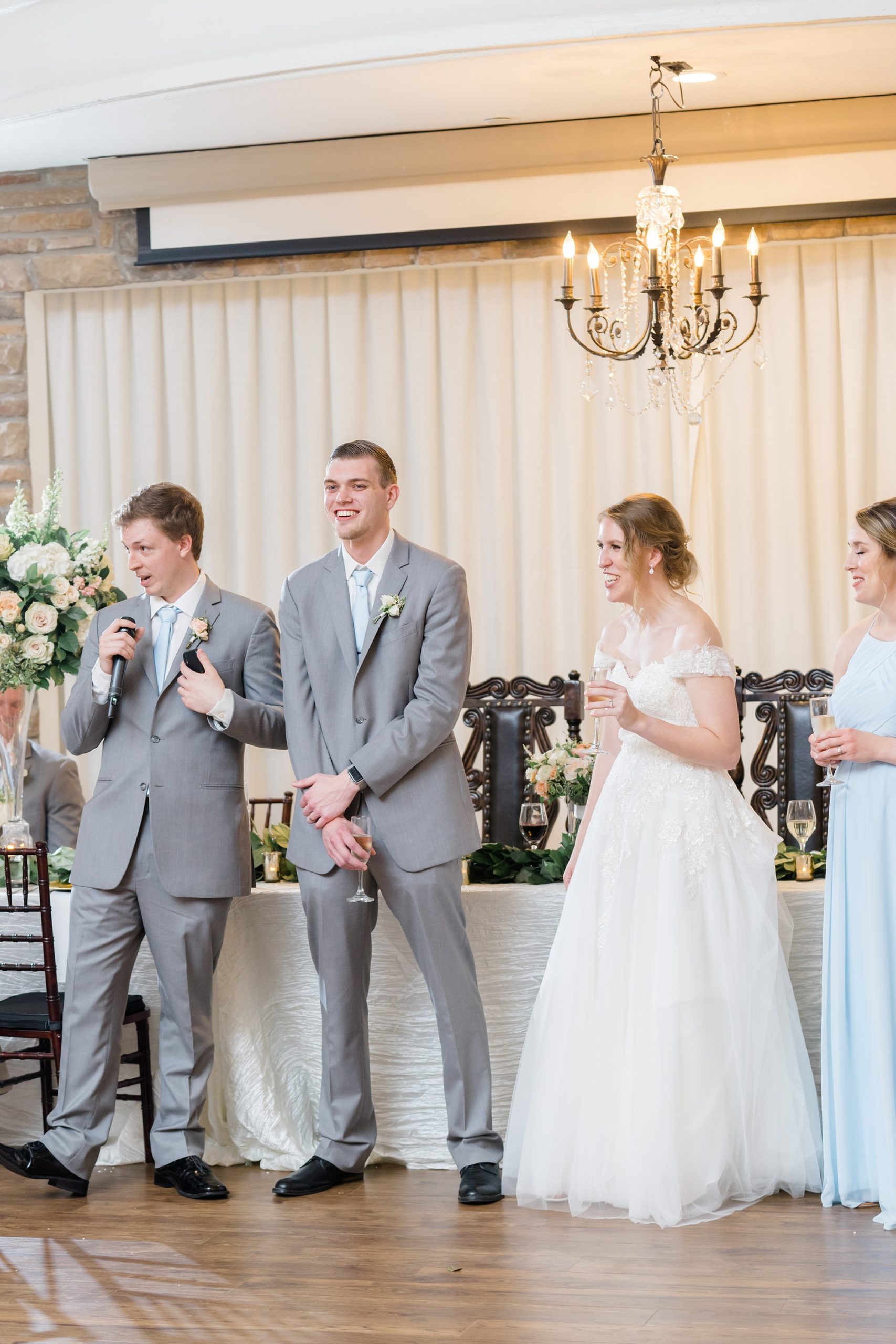 newlyweds laugh during toasts at Texas wedding reception