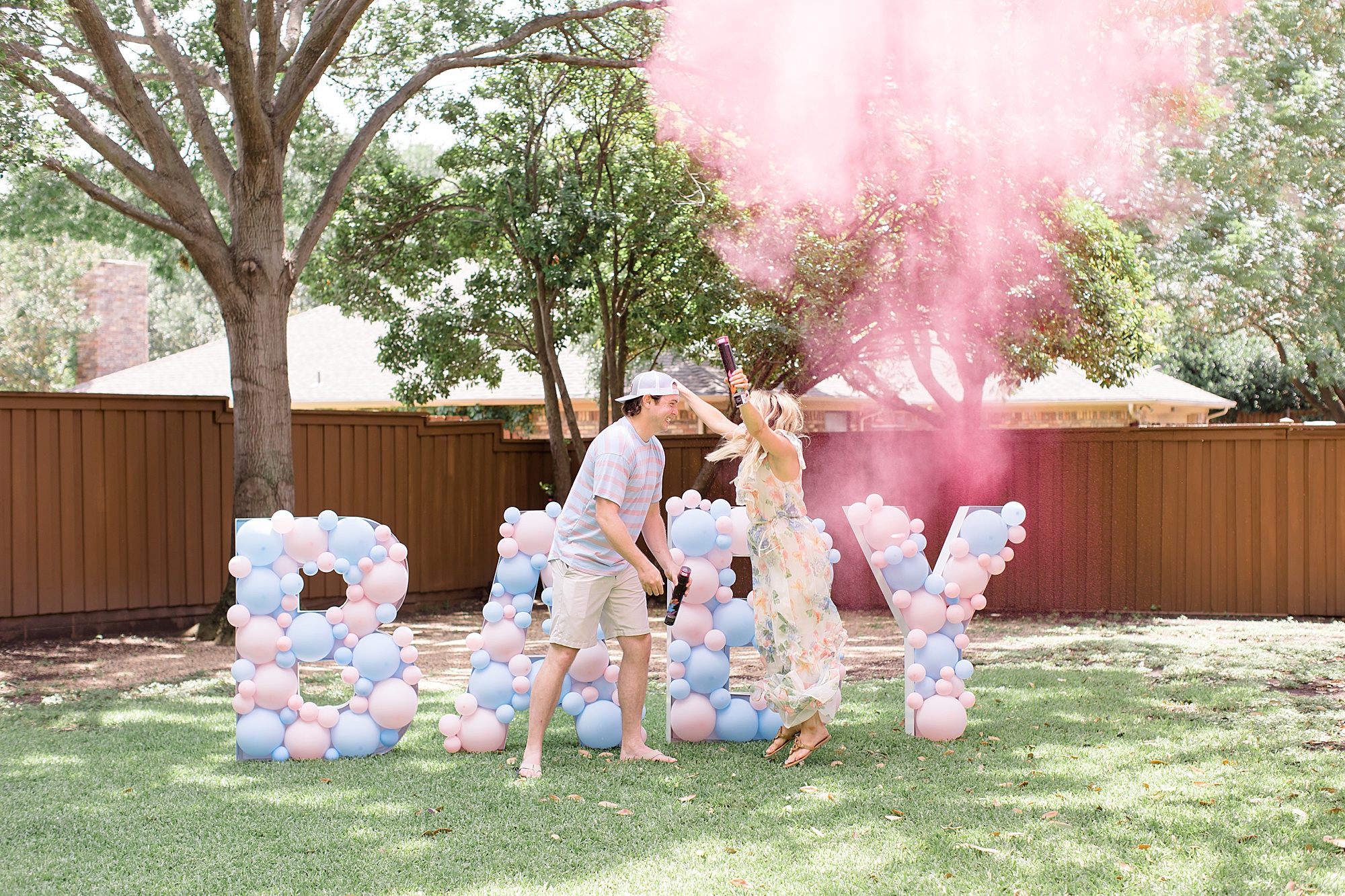 parents jump during reveal for BABY gender reveal party