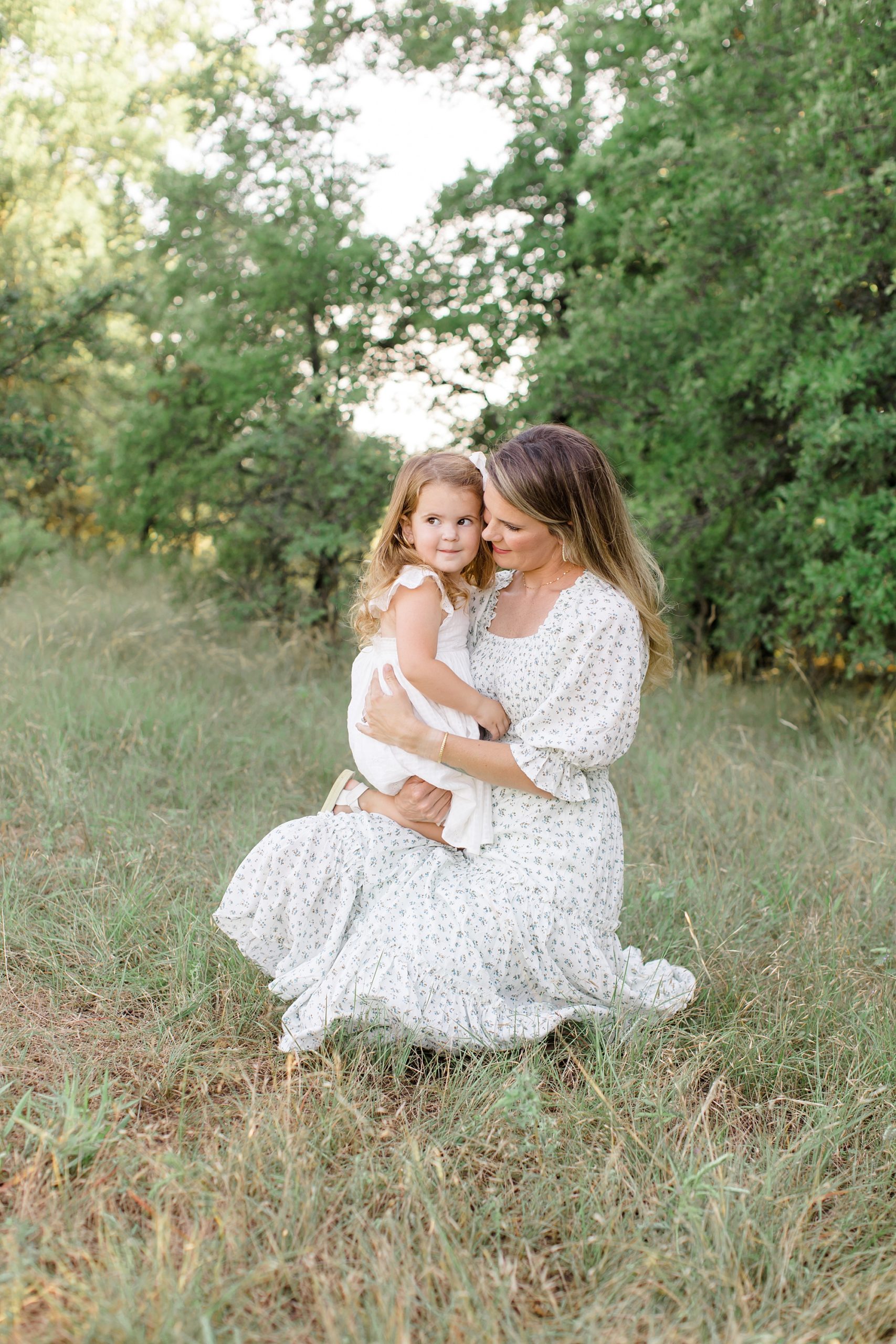 mom holds daughter during TX family photos