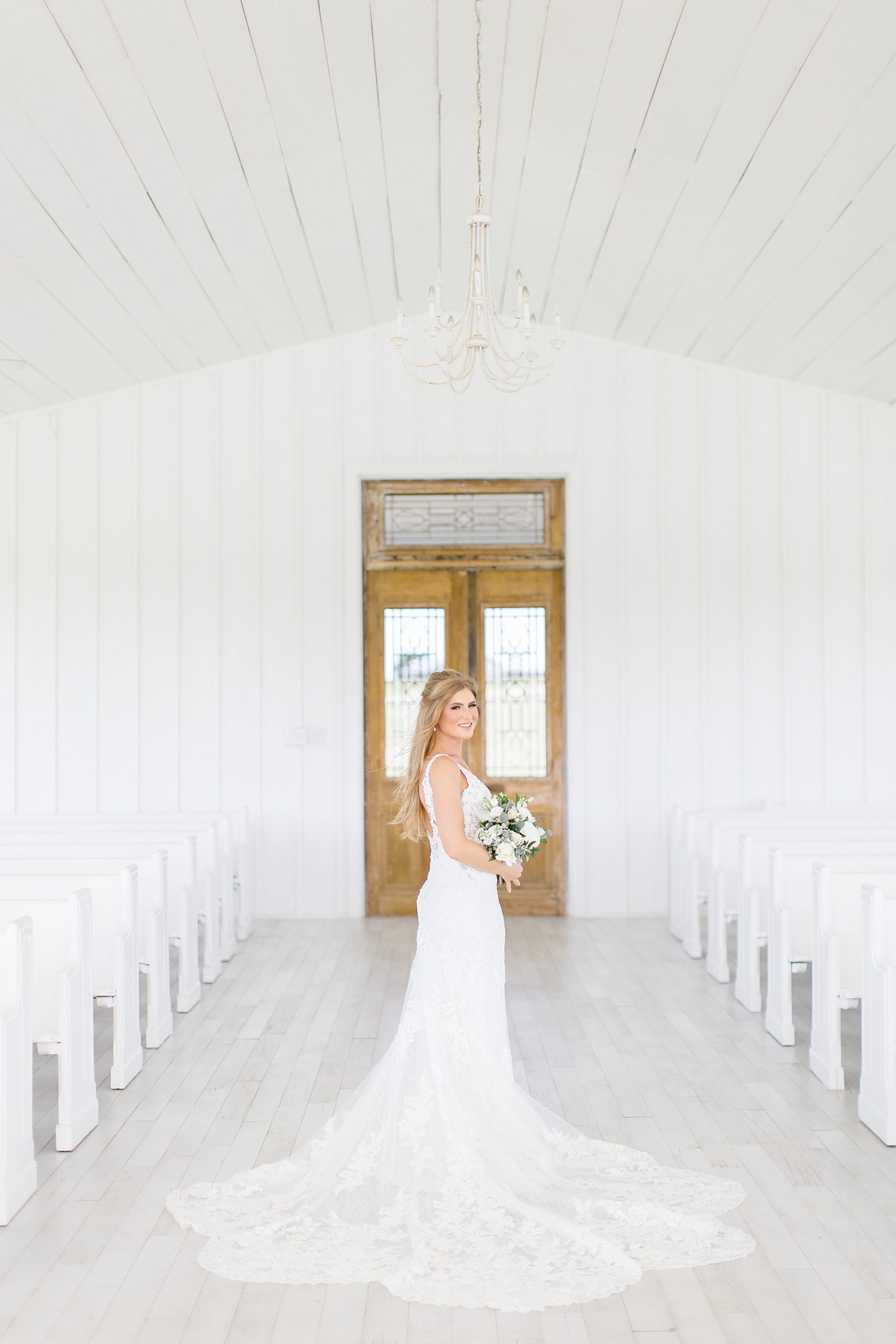 bride poses in chapel at The Grand Ivory