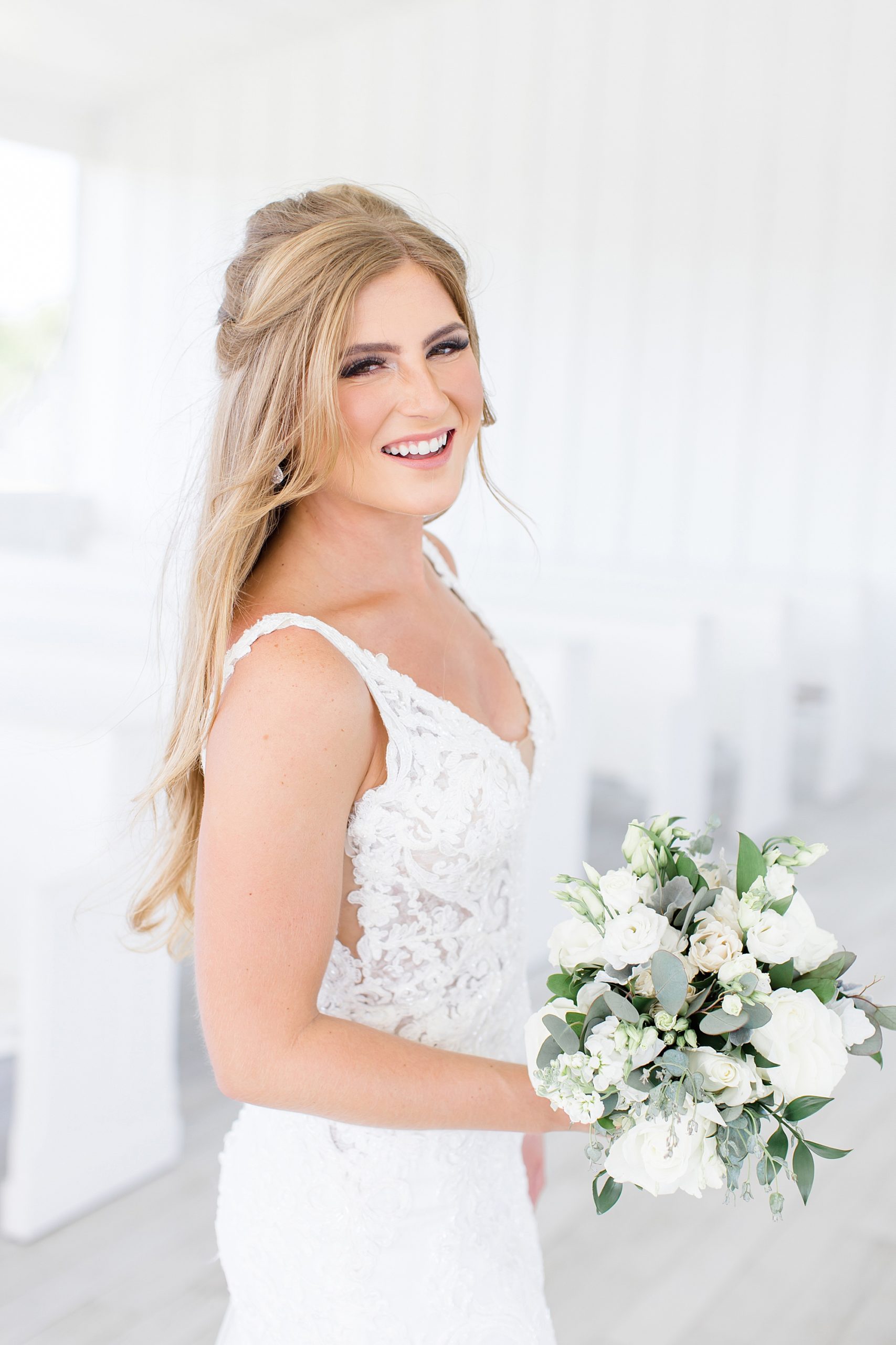 bride smiles looking over her shoulder during TX bridal session