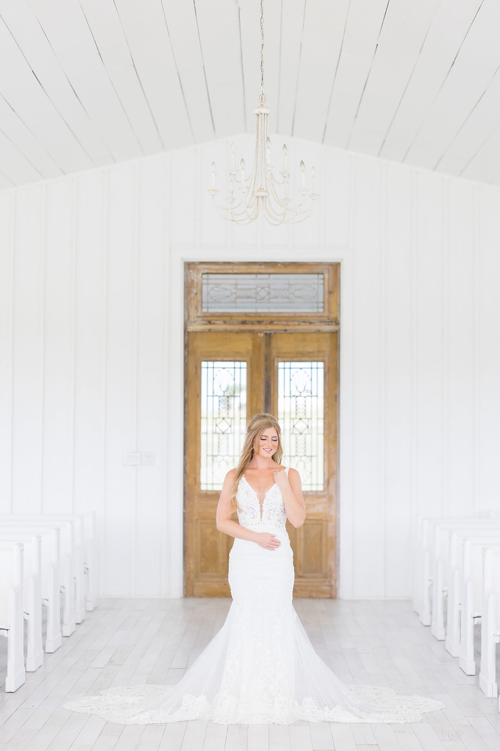 The Grand Ivory bridal portraits with bride in lace gown 
