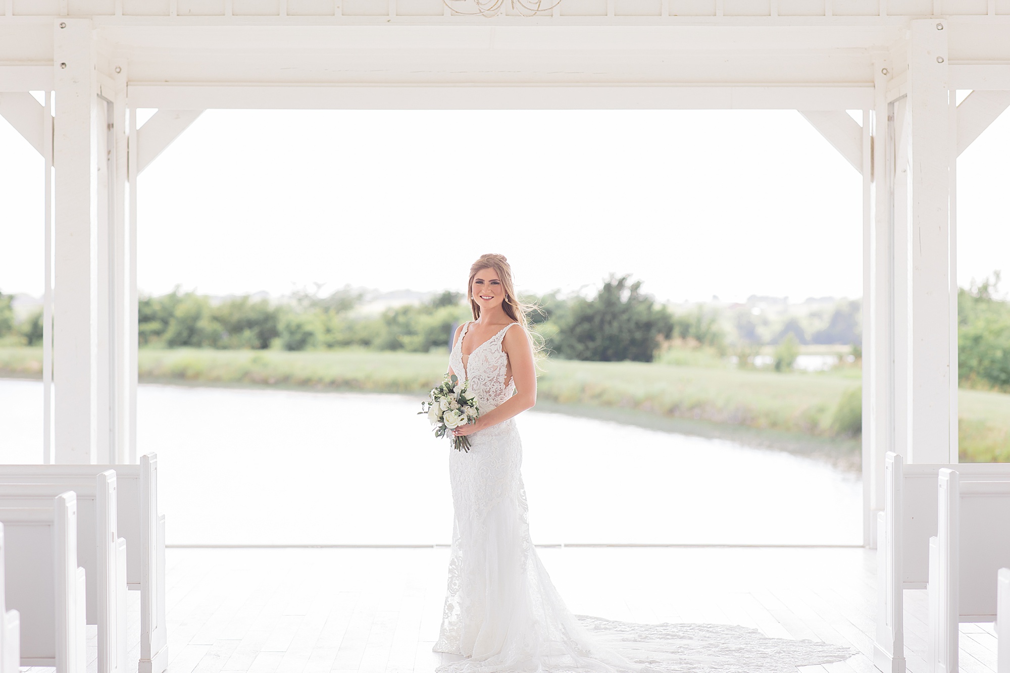 bride poses under archway at The Grand Ivory