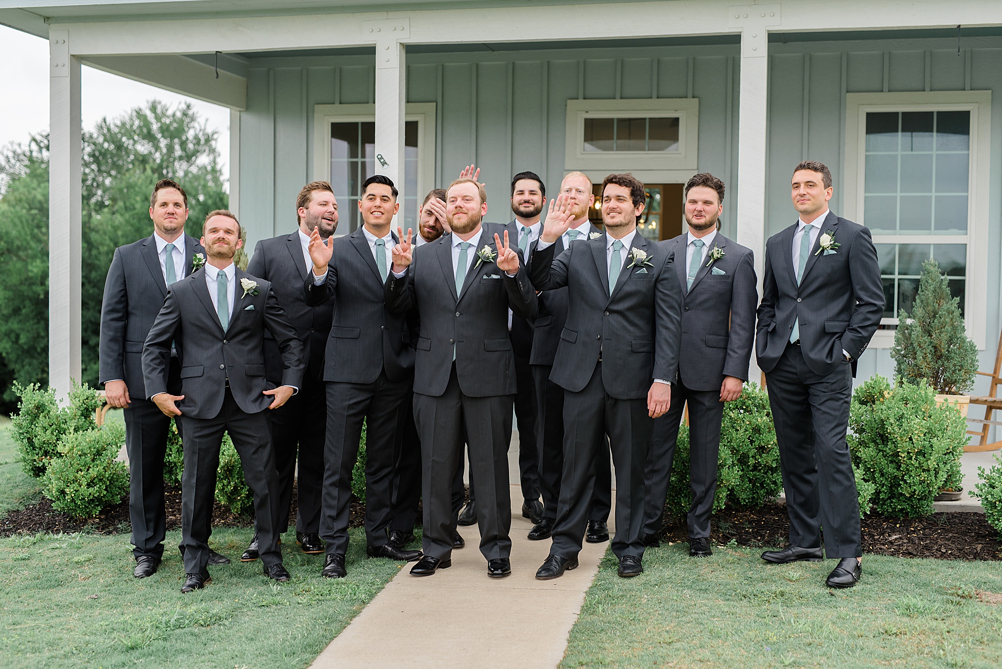 groom and groomsmen pose before Texas wedding day