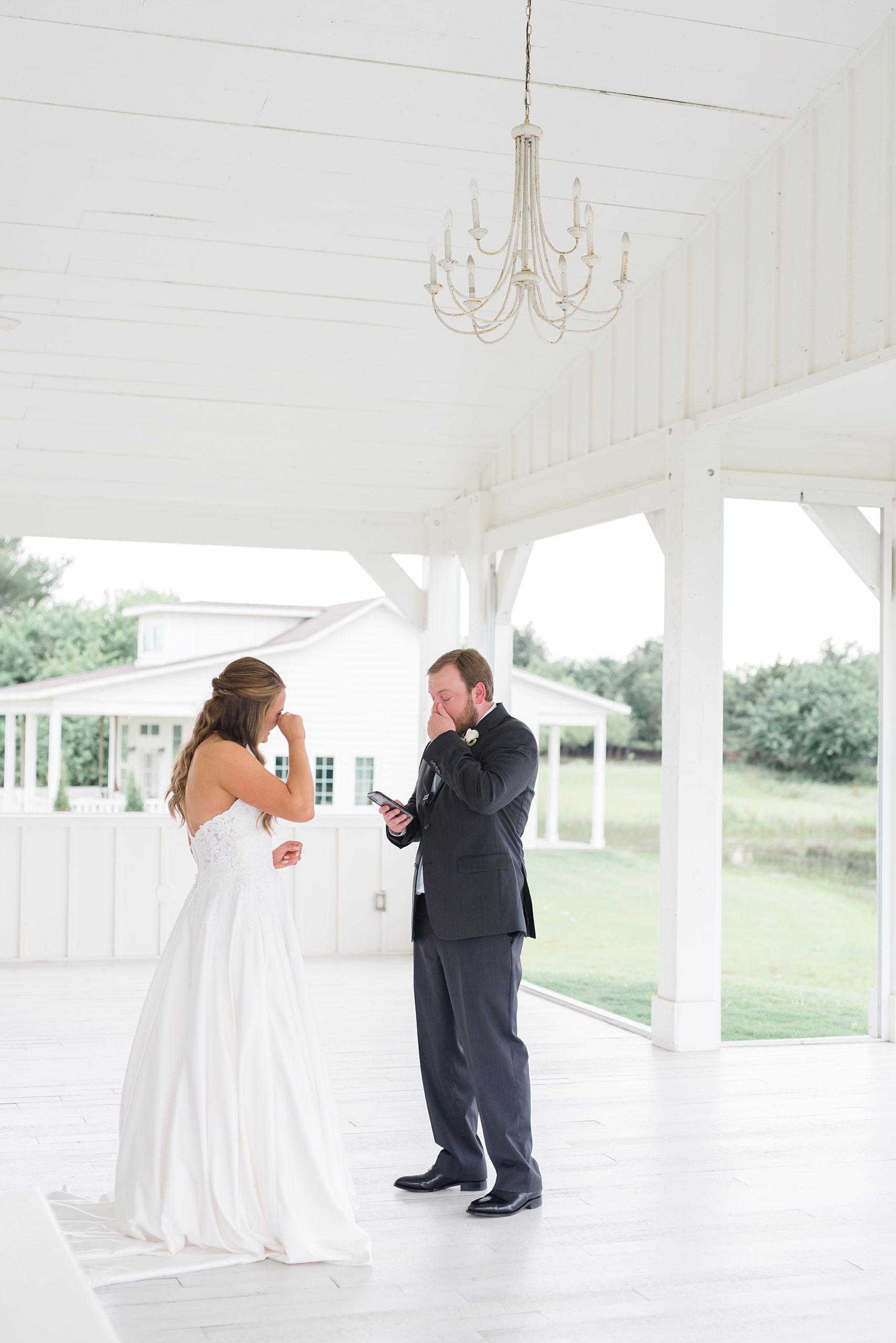 bride and groom cry during first look in Leonard TX