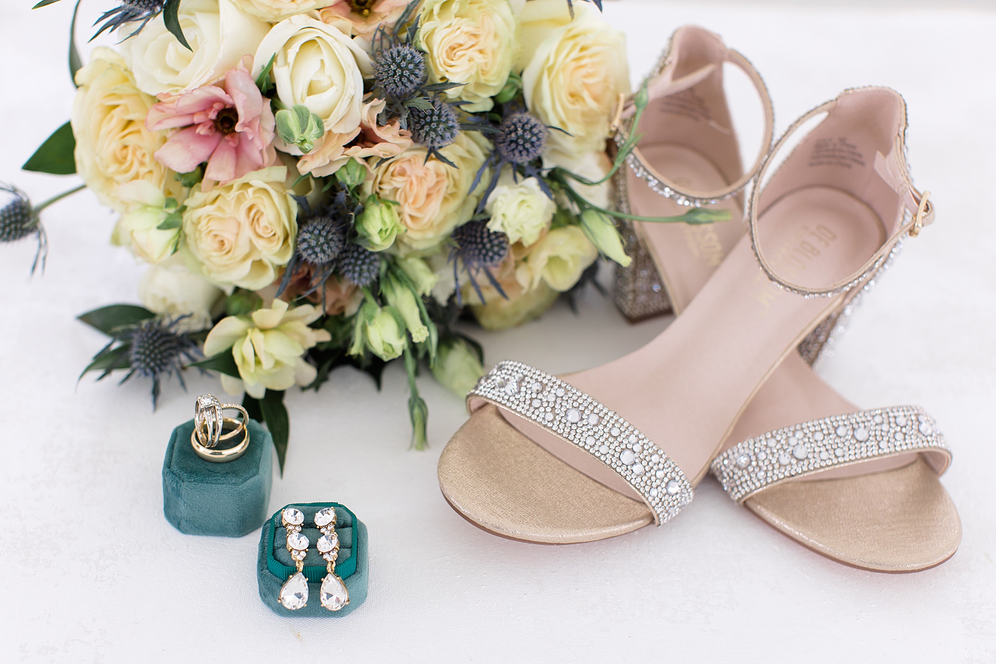 bride's details and jewelry on emerald box