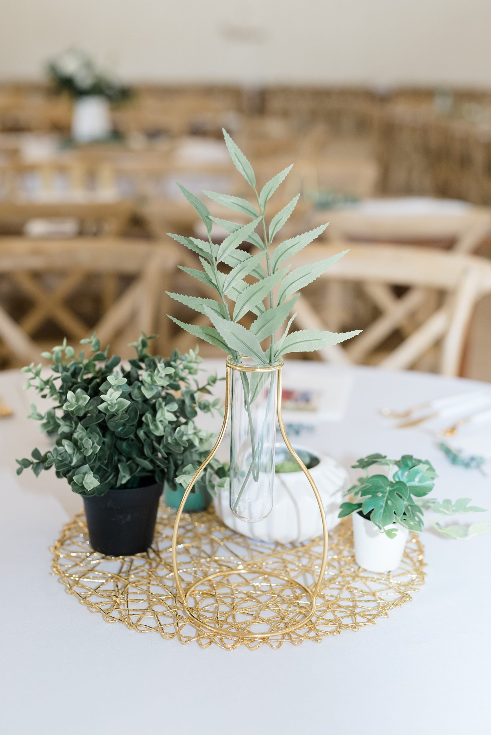 centerpieces with gold accents and green succulents