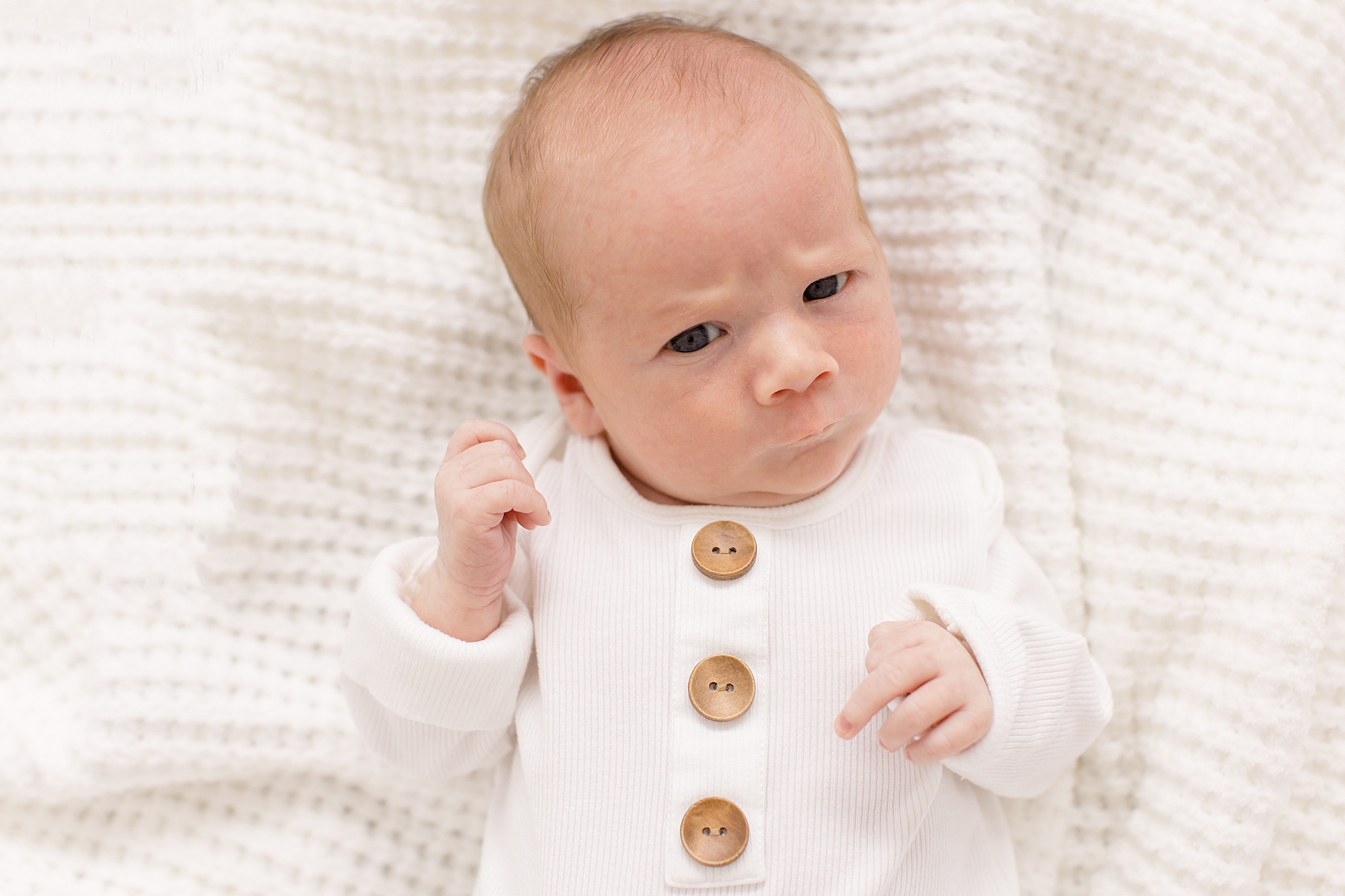 baby scowls during lifestyle newborn session