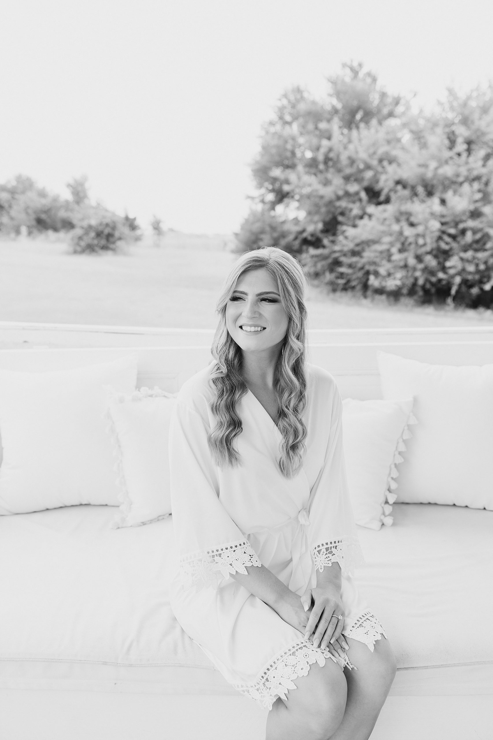 bride sits on couch at The Grand Ivory