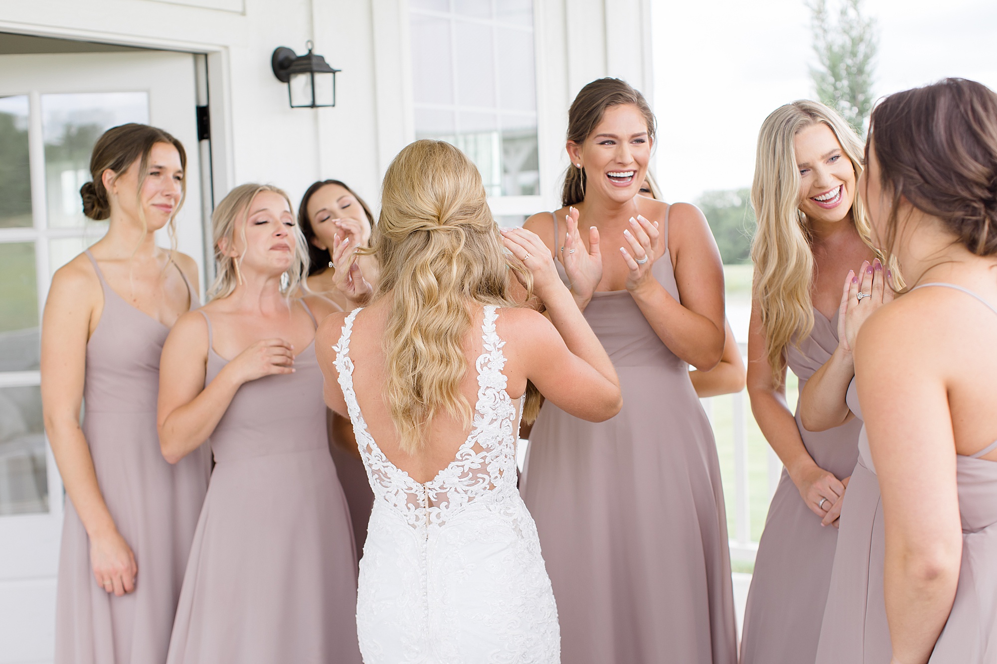 bride has first look with bridesmaids