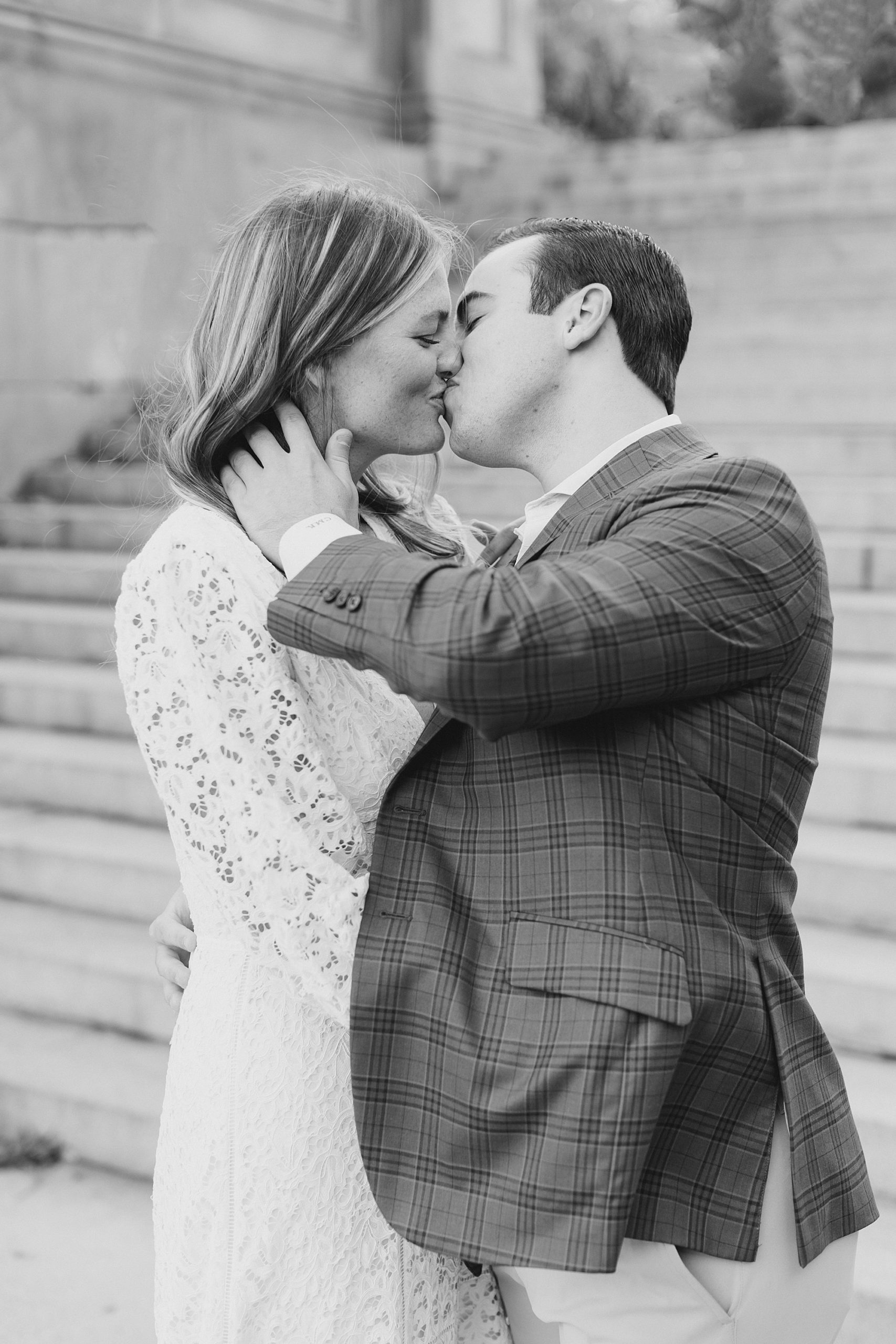 bride and groom kiss during Central Park engagement session