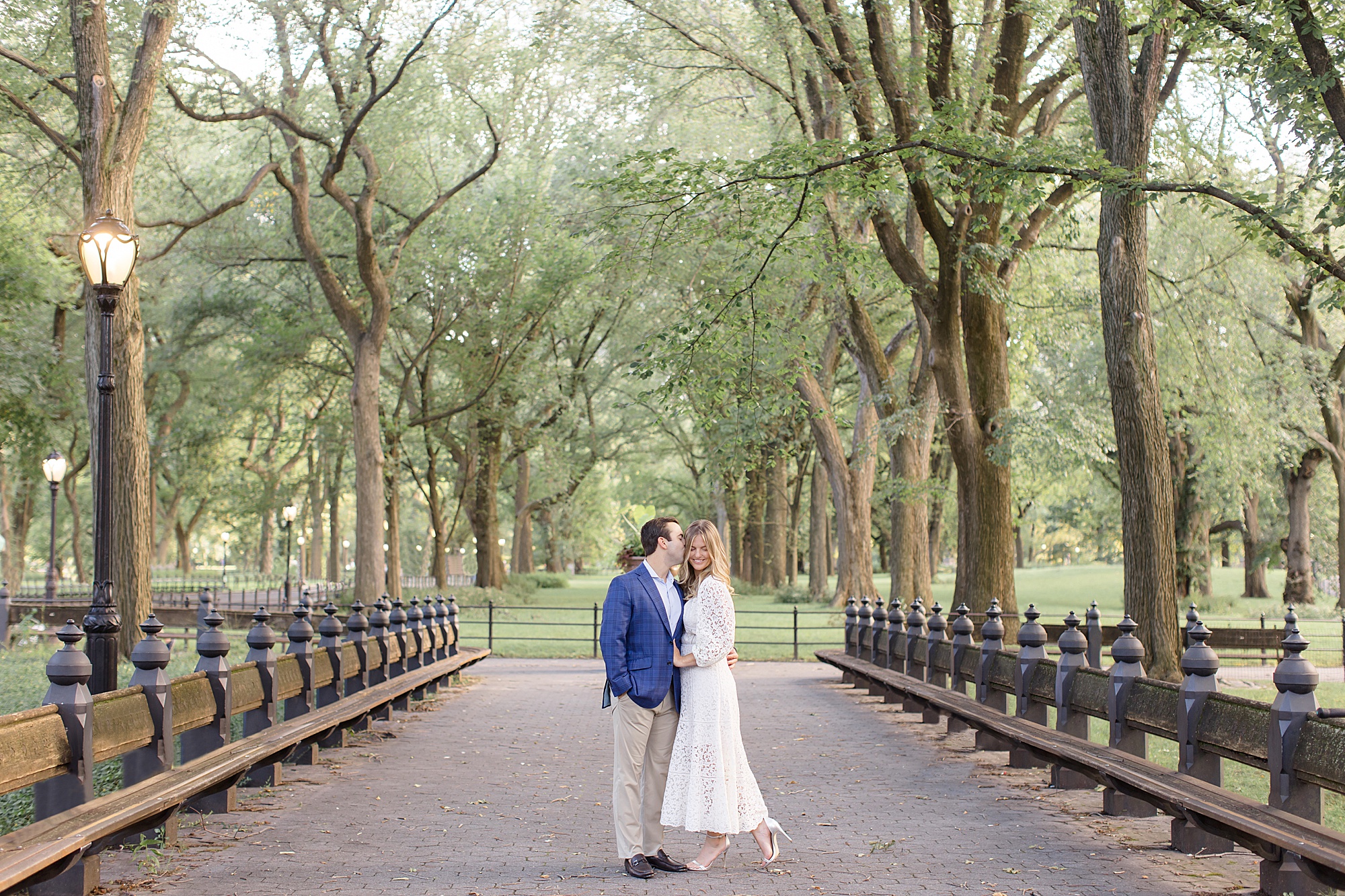 couple walks through park during NYC engagement session