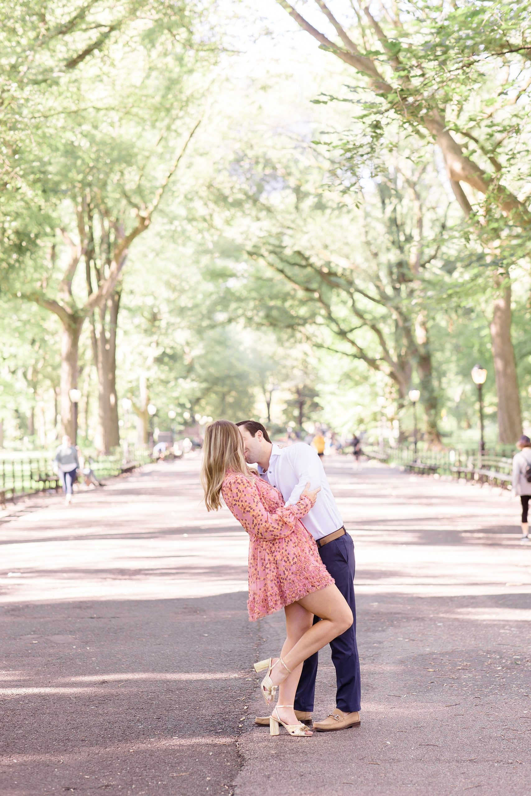 groom kisses bride during Central Park engagement session