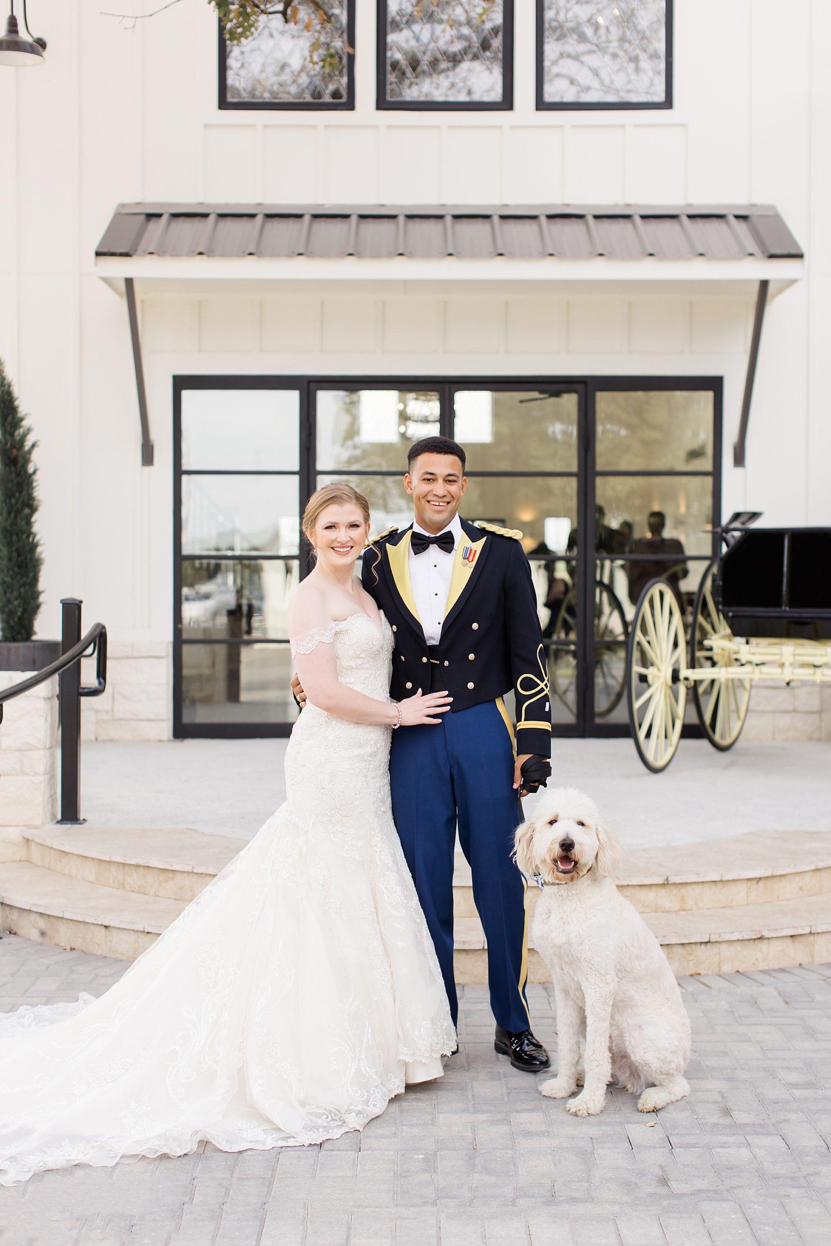 newlyweds stand with dog during portraits in Texas