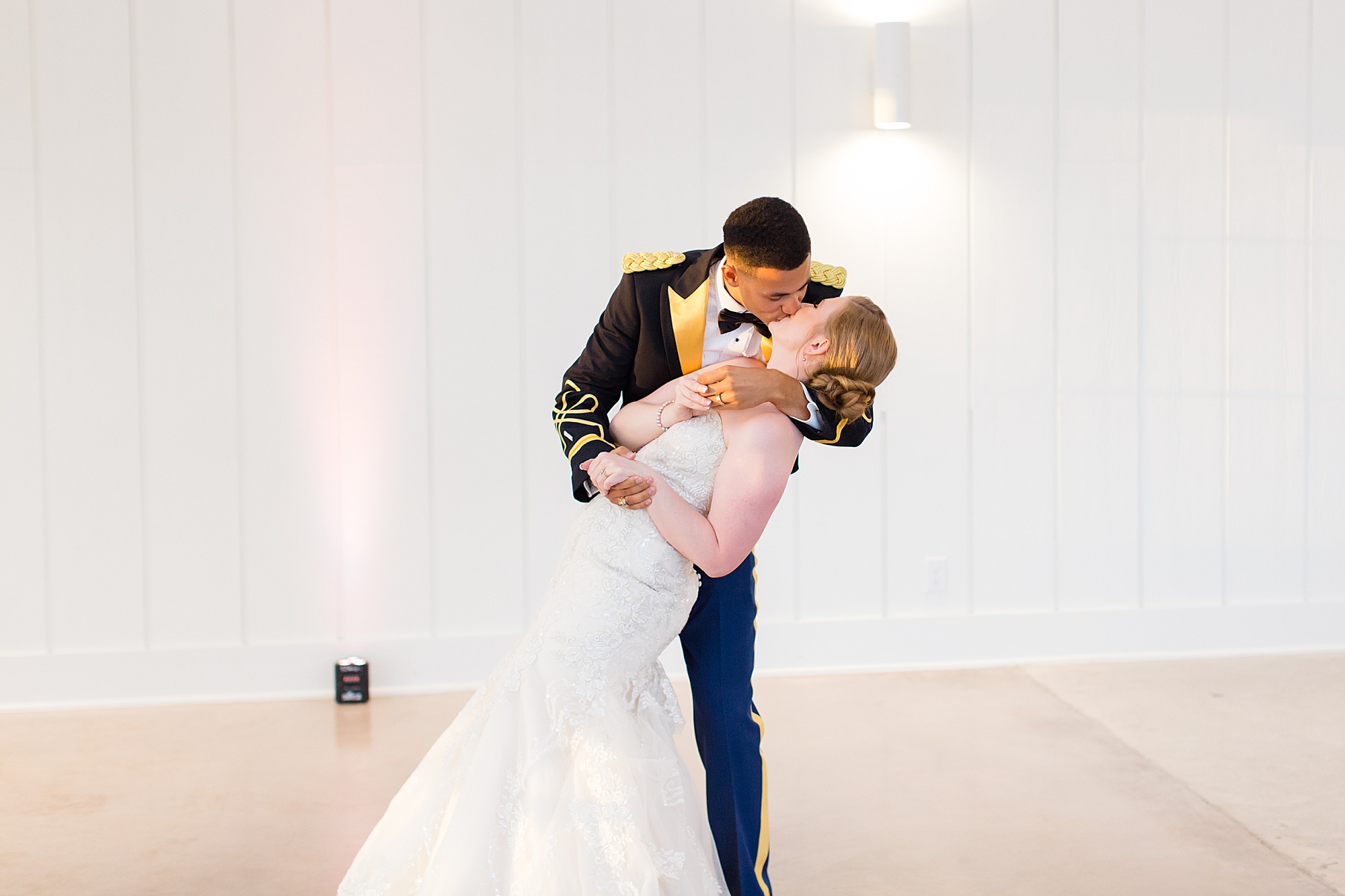 groom kisses bride during dance at Aubrey TX wedding reception
