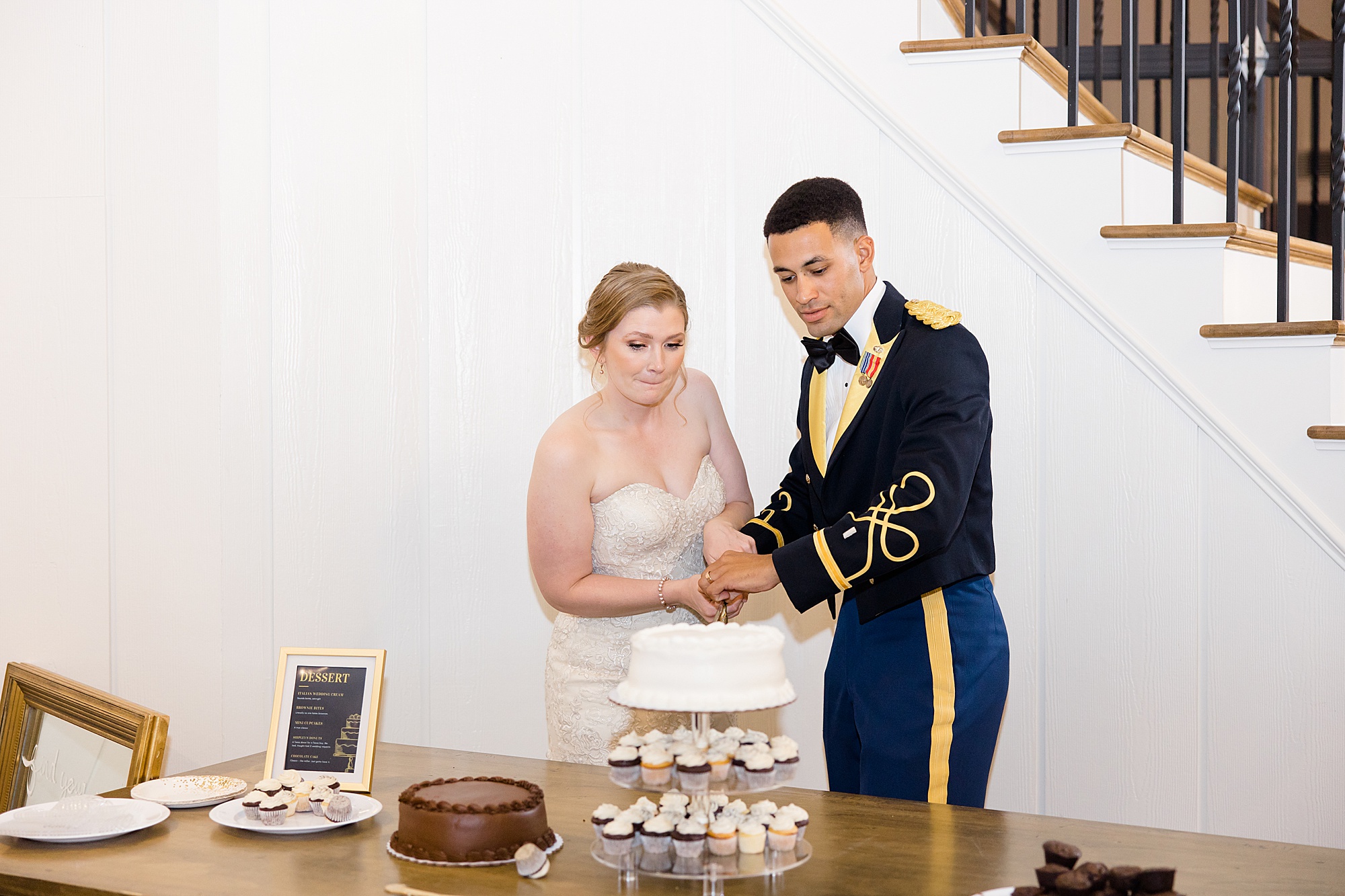 bride and groom cut wedding cake during Bella Cavalli reception