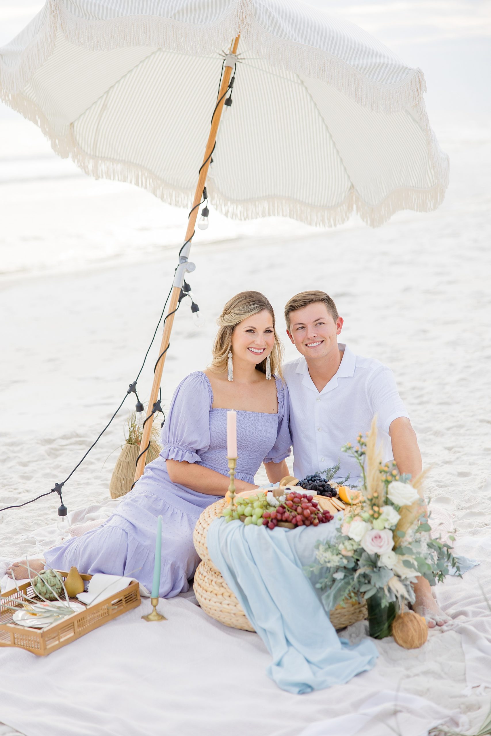 engaged couple enjoys picnic during Rosemary Beach engagement session