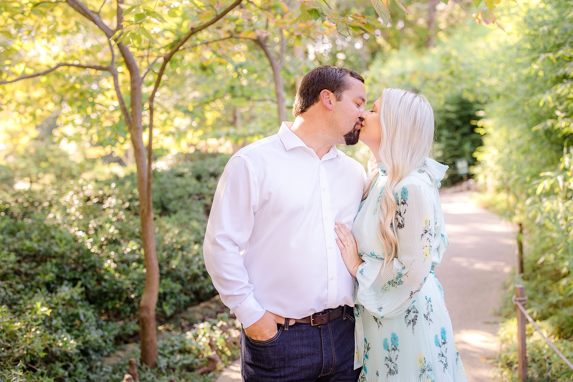 bride and groom kiss during Kimball Art Museum engagement photos