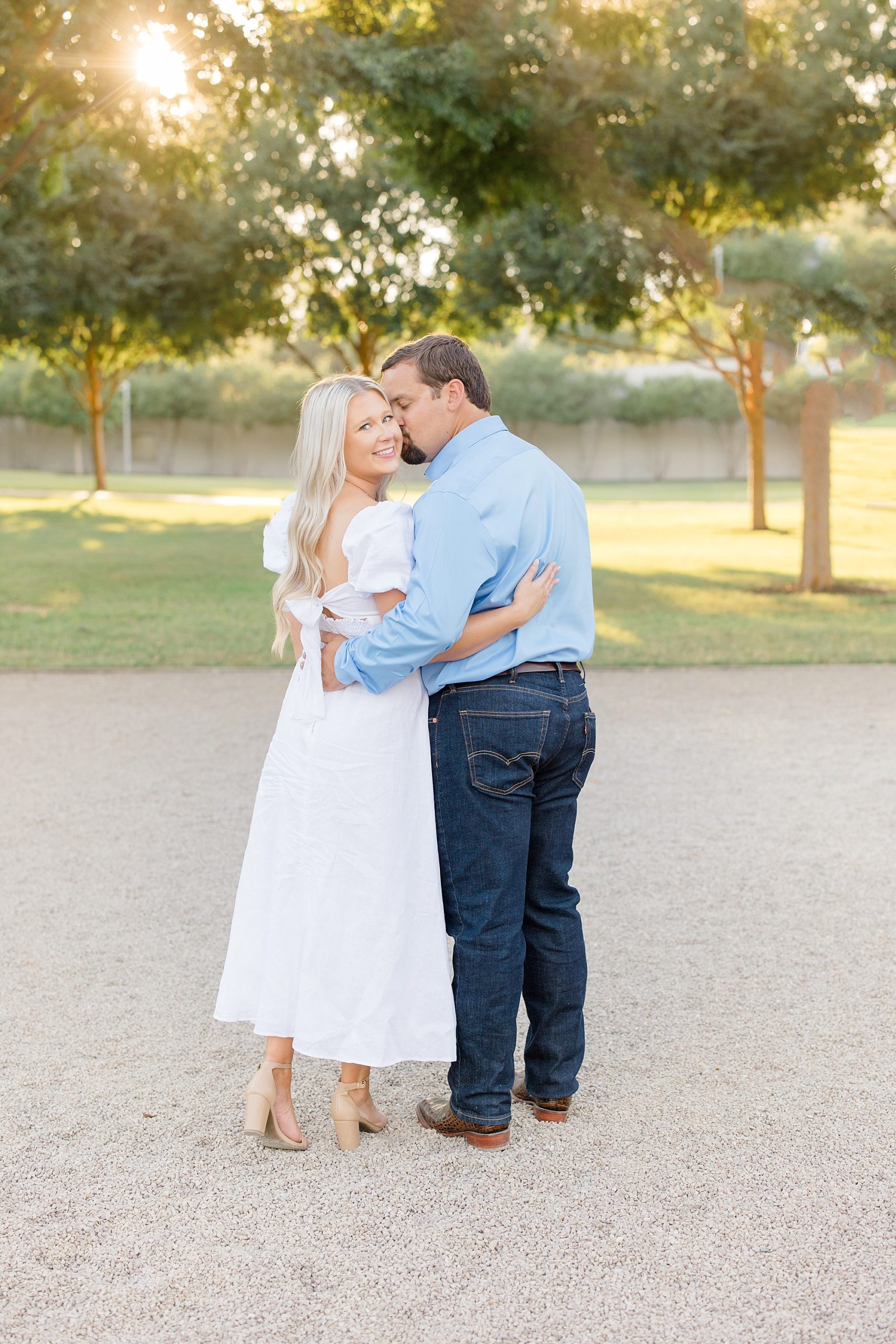 bride and groom hug during TX engagement photos