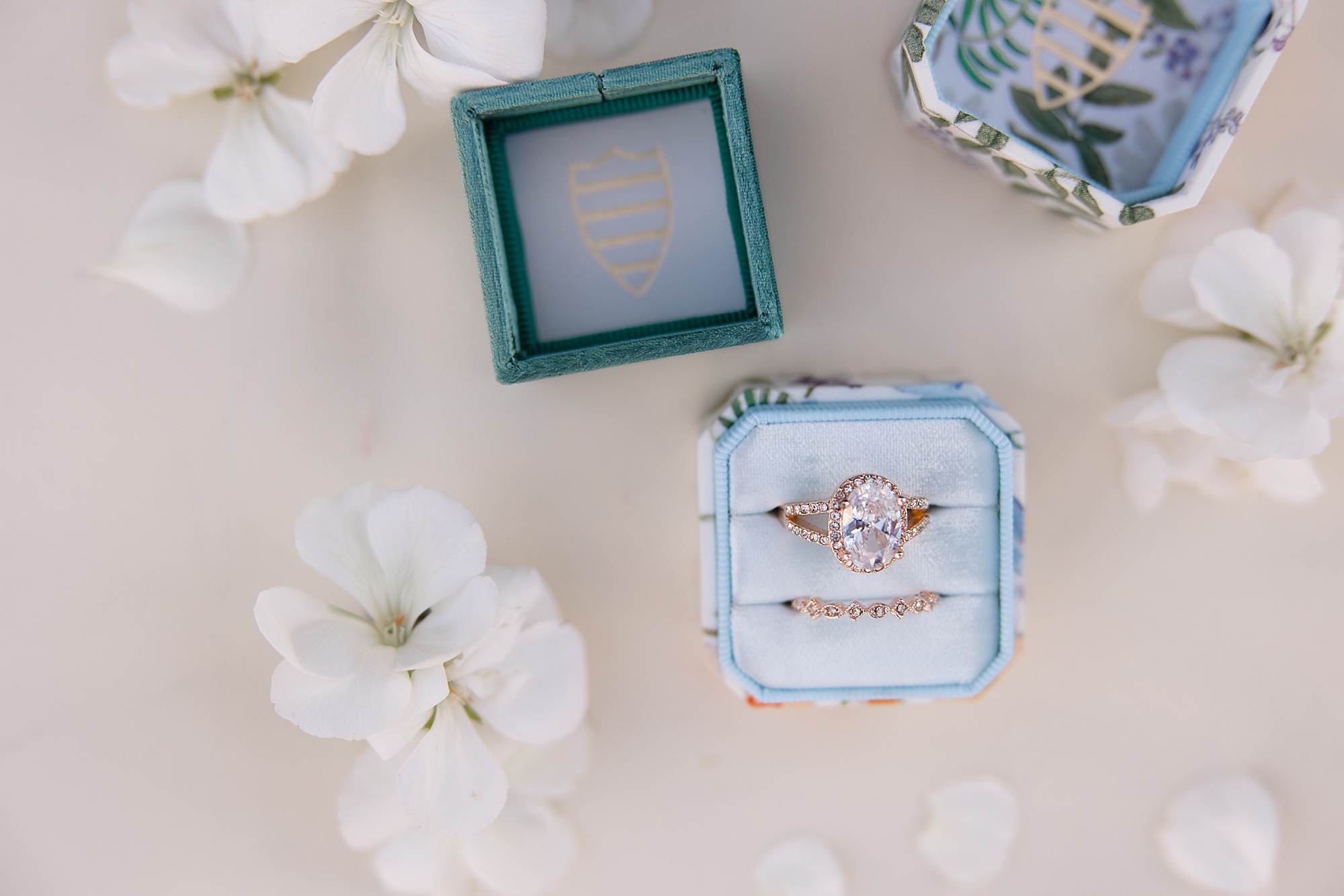 wedding rings in pink and green boxes for desert inspired styled shoot
