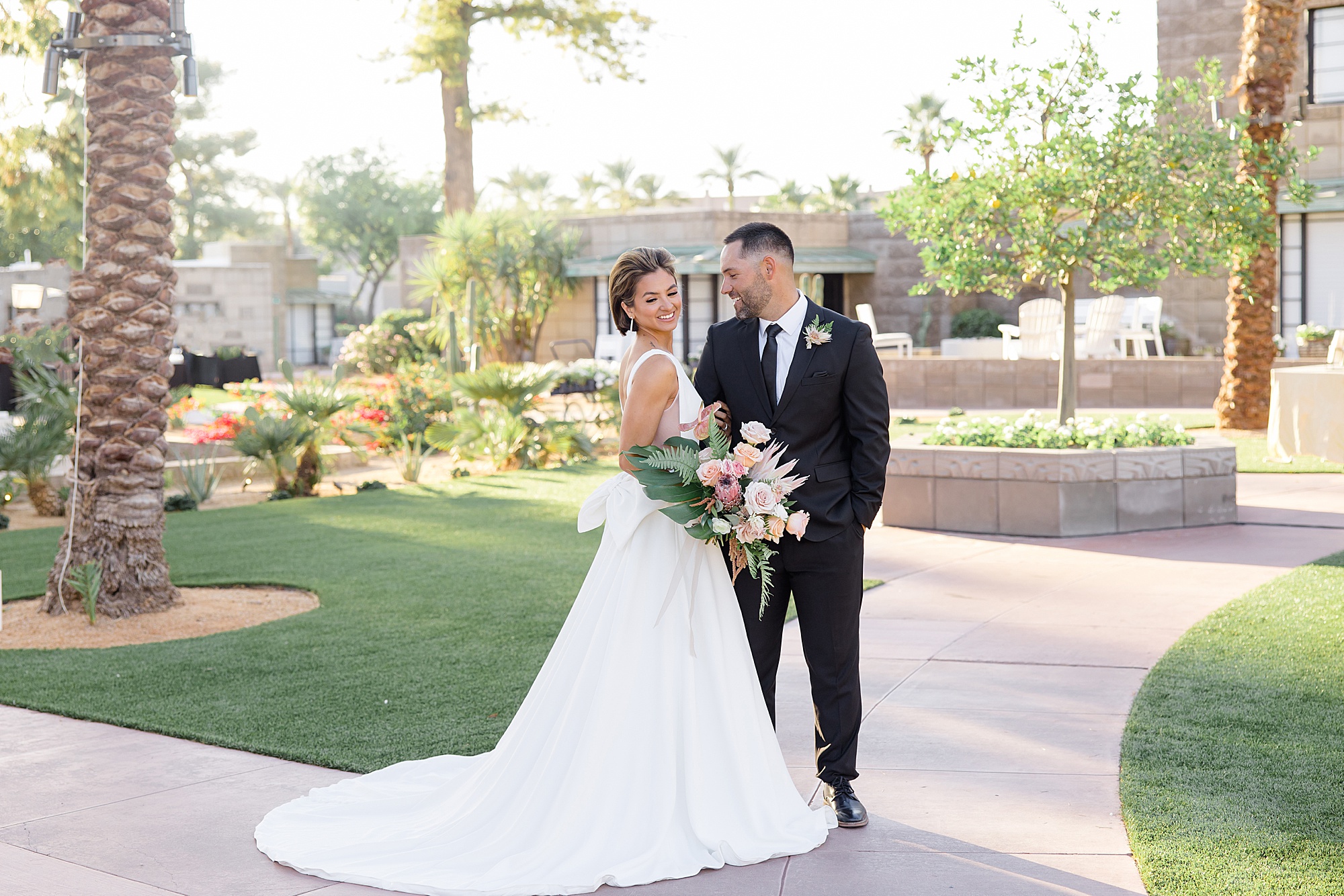groom looks at bride during desert inspired styled shoot at the Arizona Biltmore 