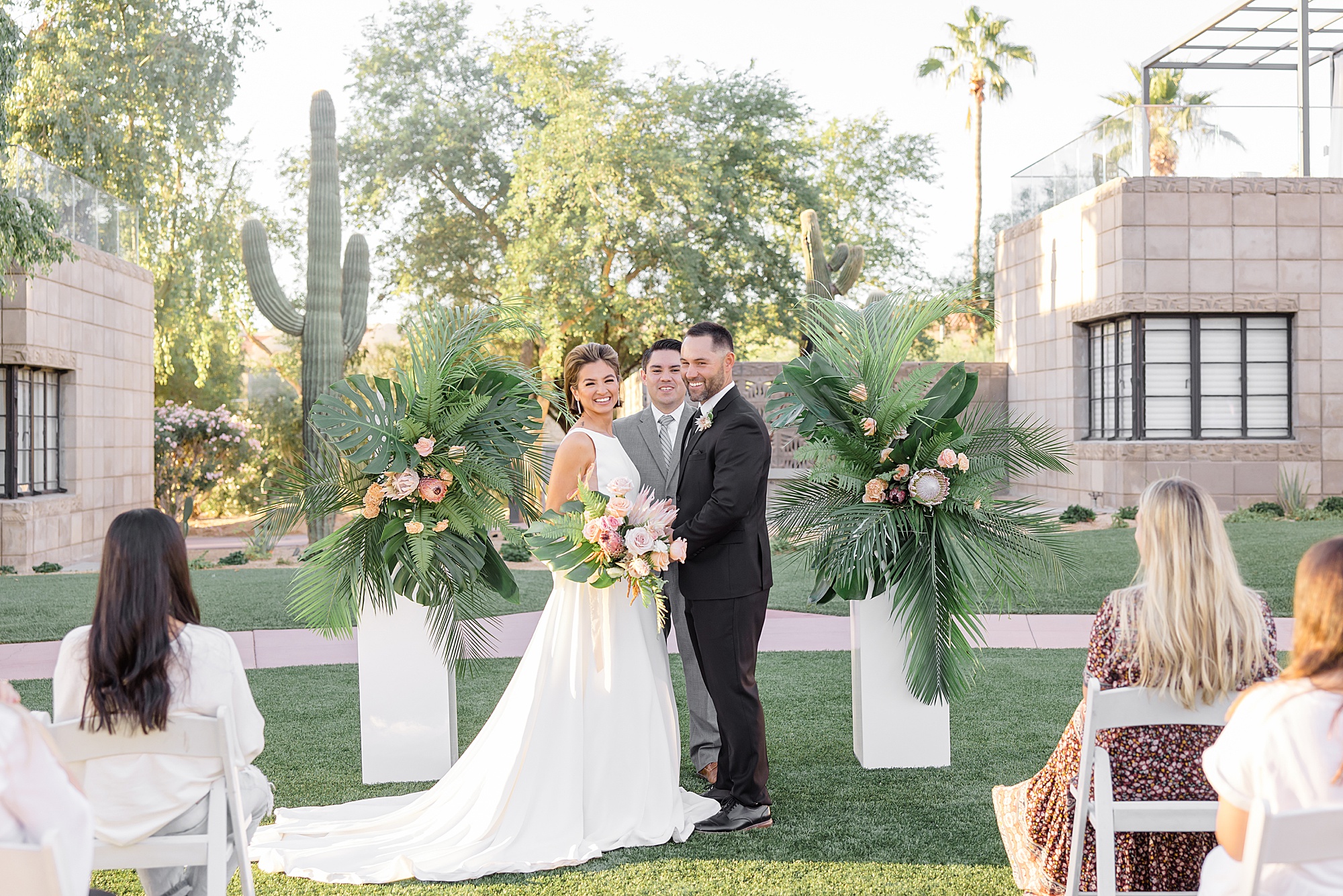 newlyweds stand at altar during desert inspired styled shoot