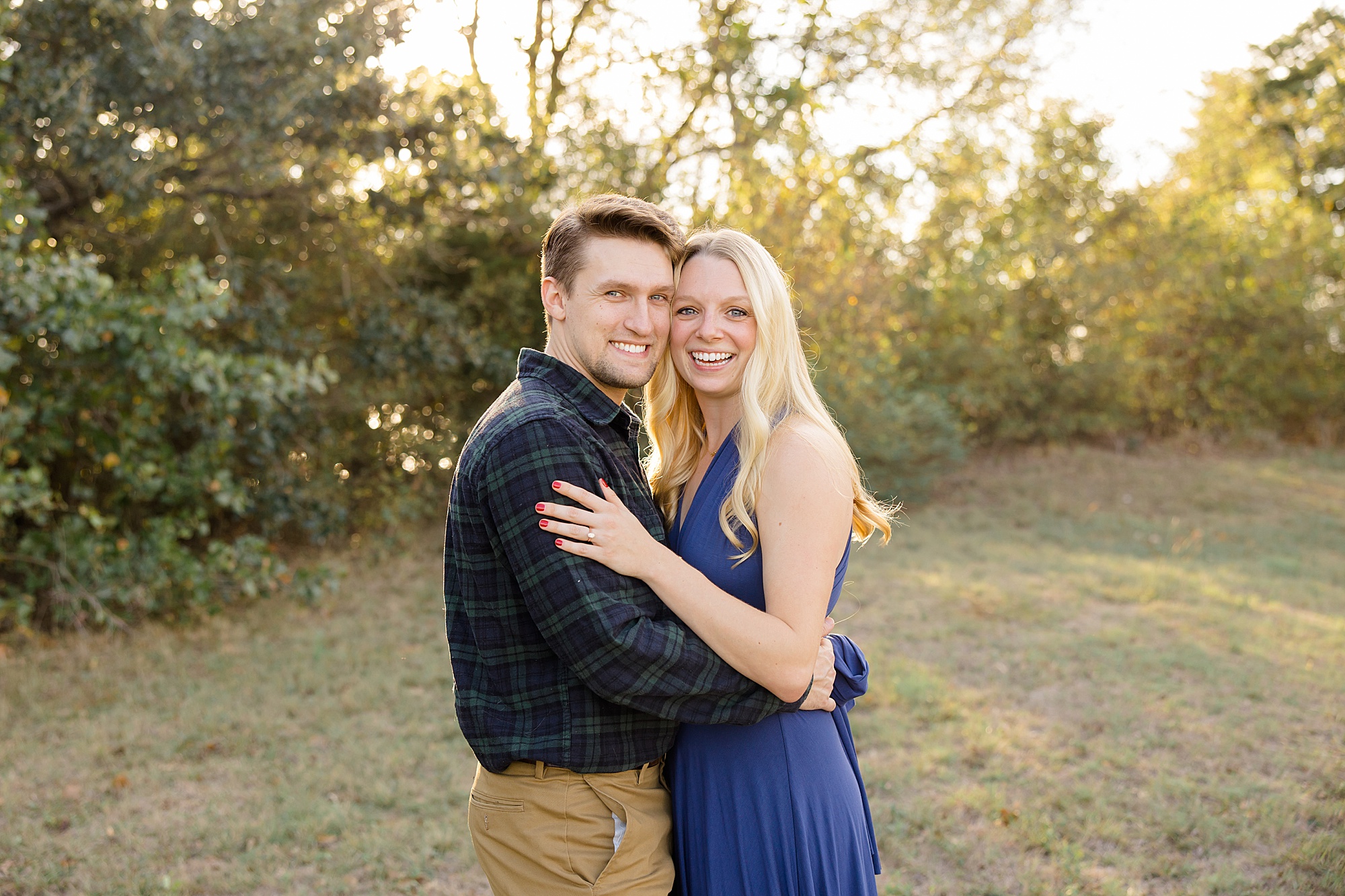 engaged couple hugs during fall engagement session