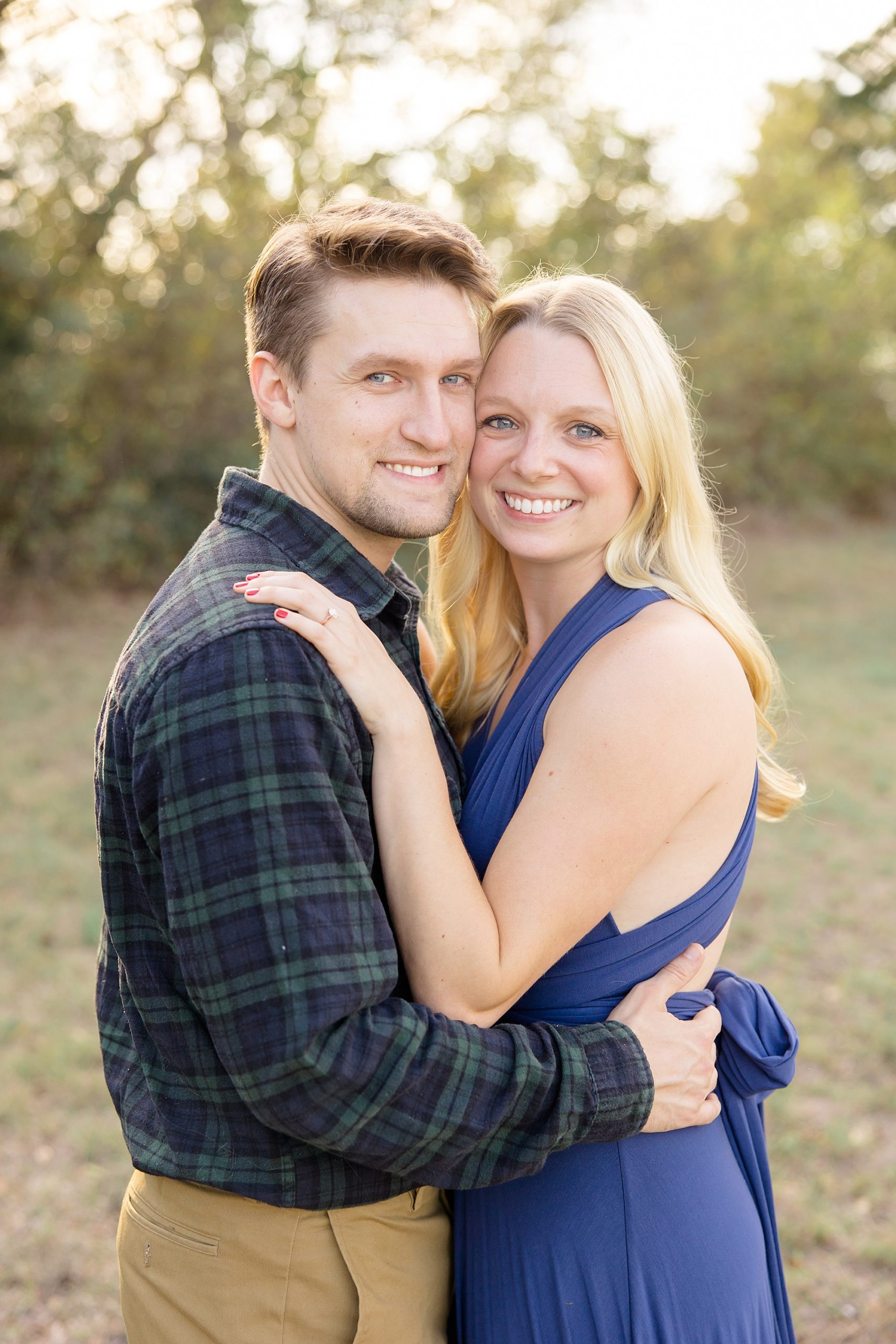 engaged couple hugs during Rockledge Park engagement session