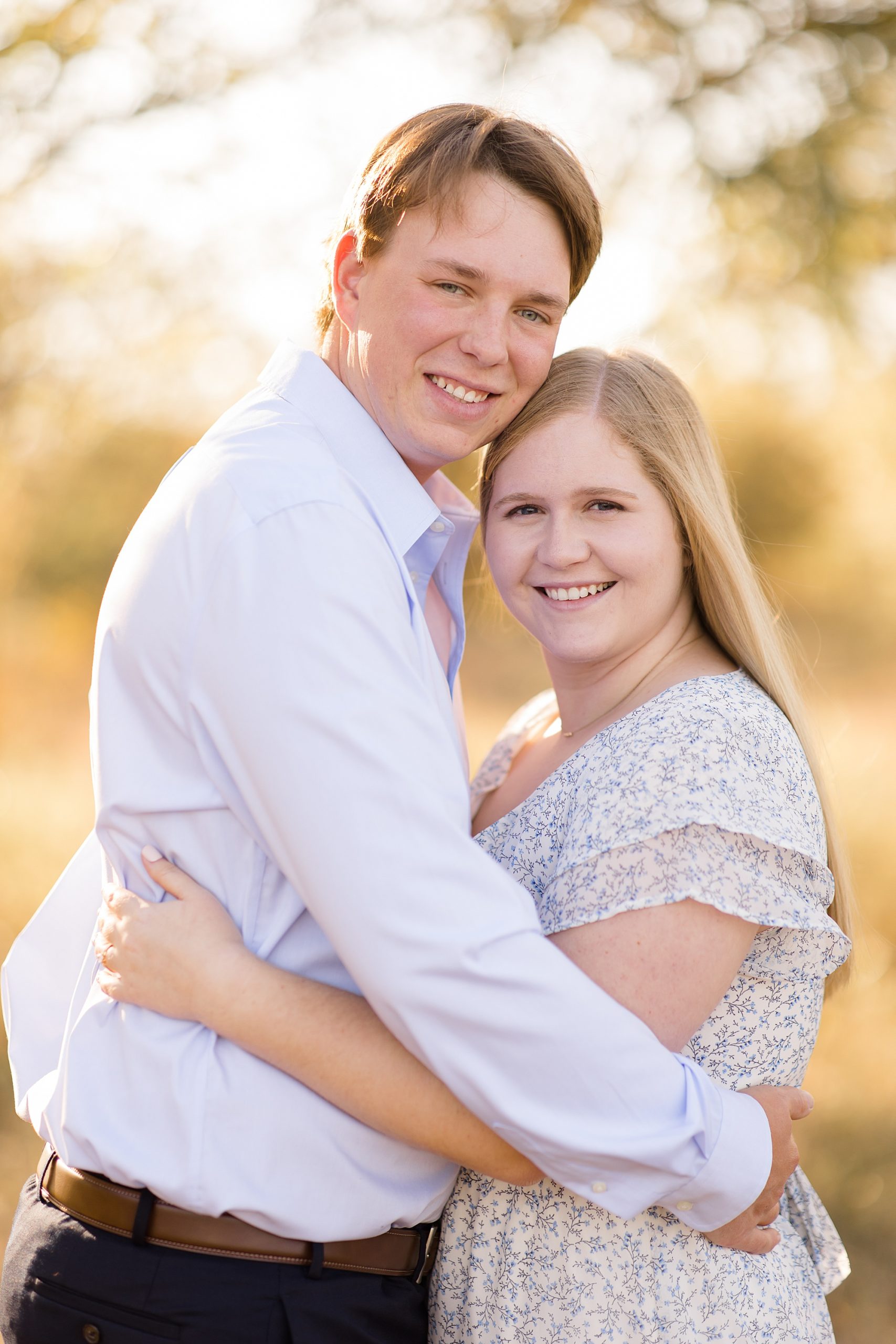 couple hugs during Ponder TX engagement photos