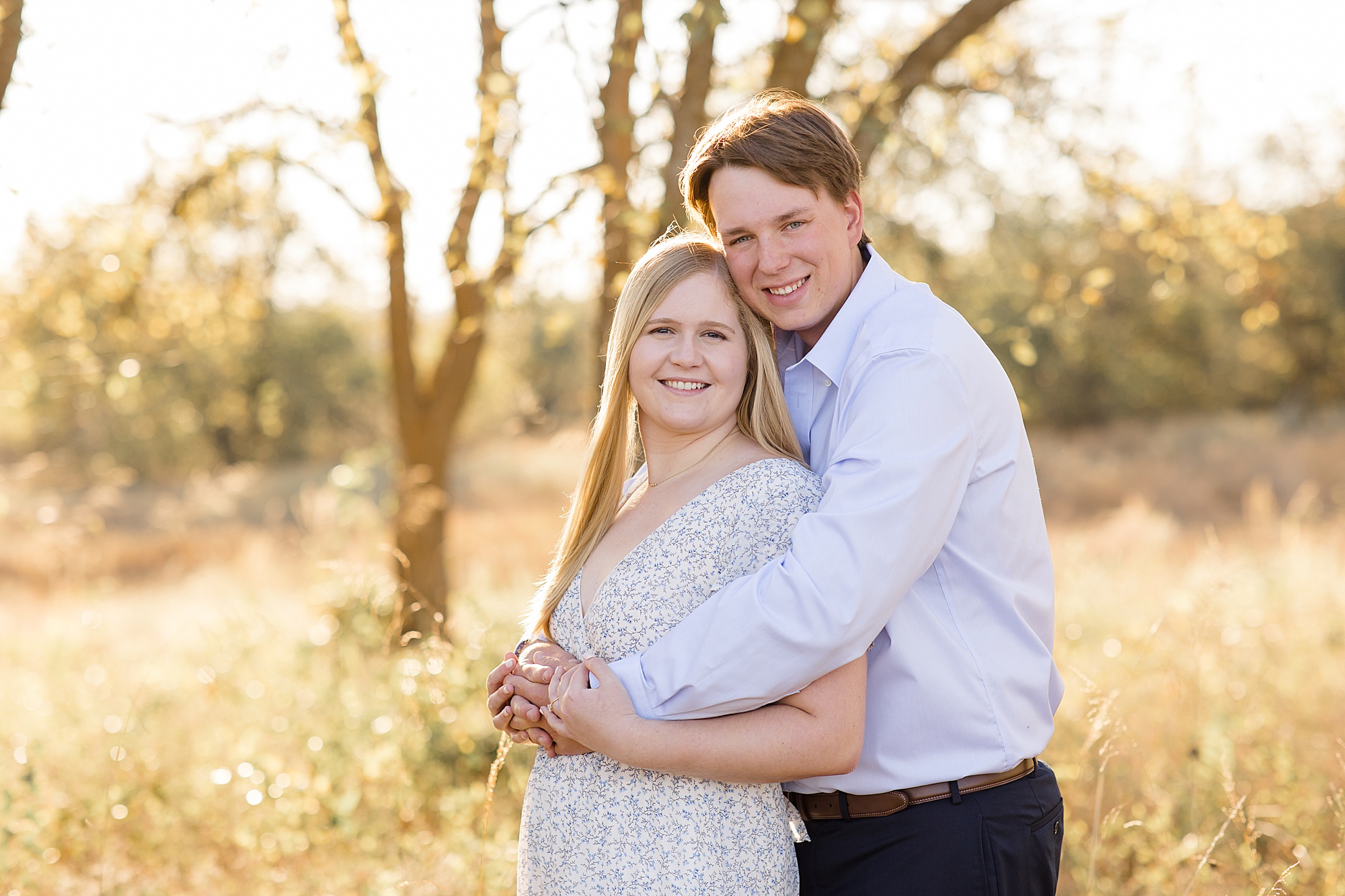 bride and groom hug during Ponder TX engagement photos