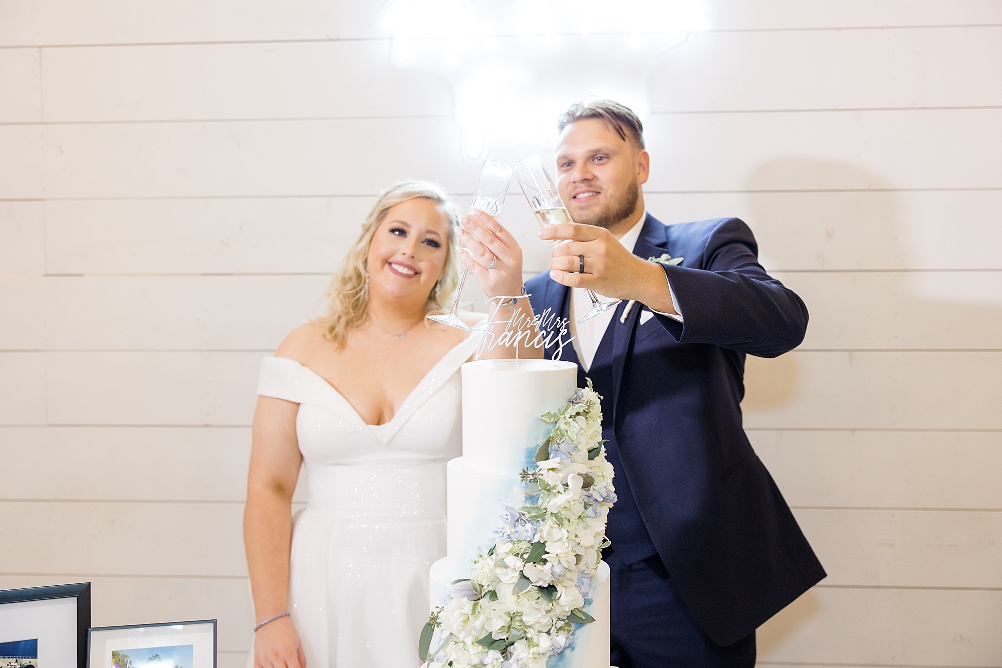 newlyweds toast champagne during Ponder TX wedding reception