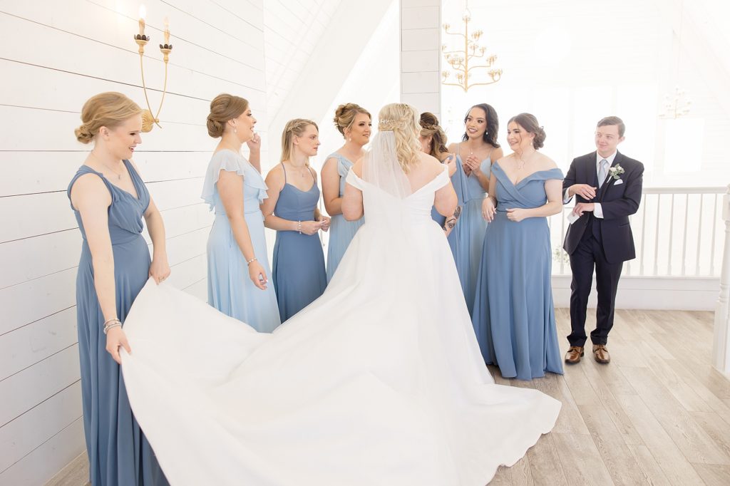 bride has first look with bridesmaids 
