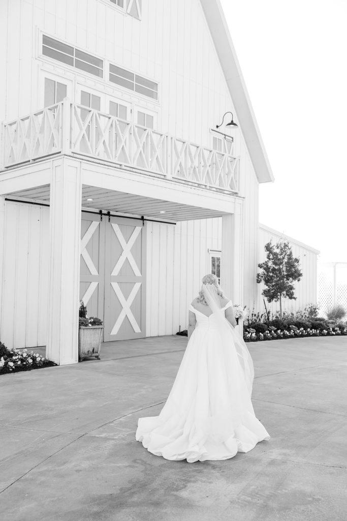 bride walks outside the Nest at Ruth Farms