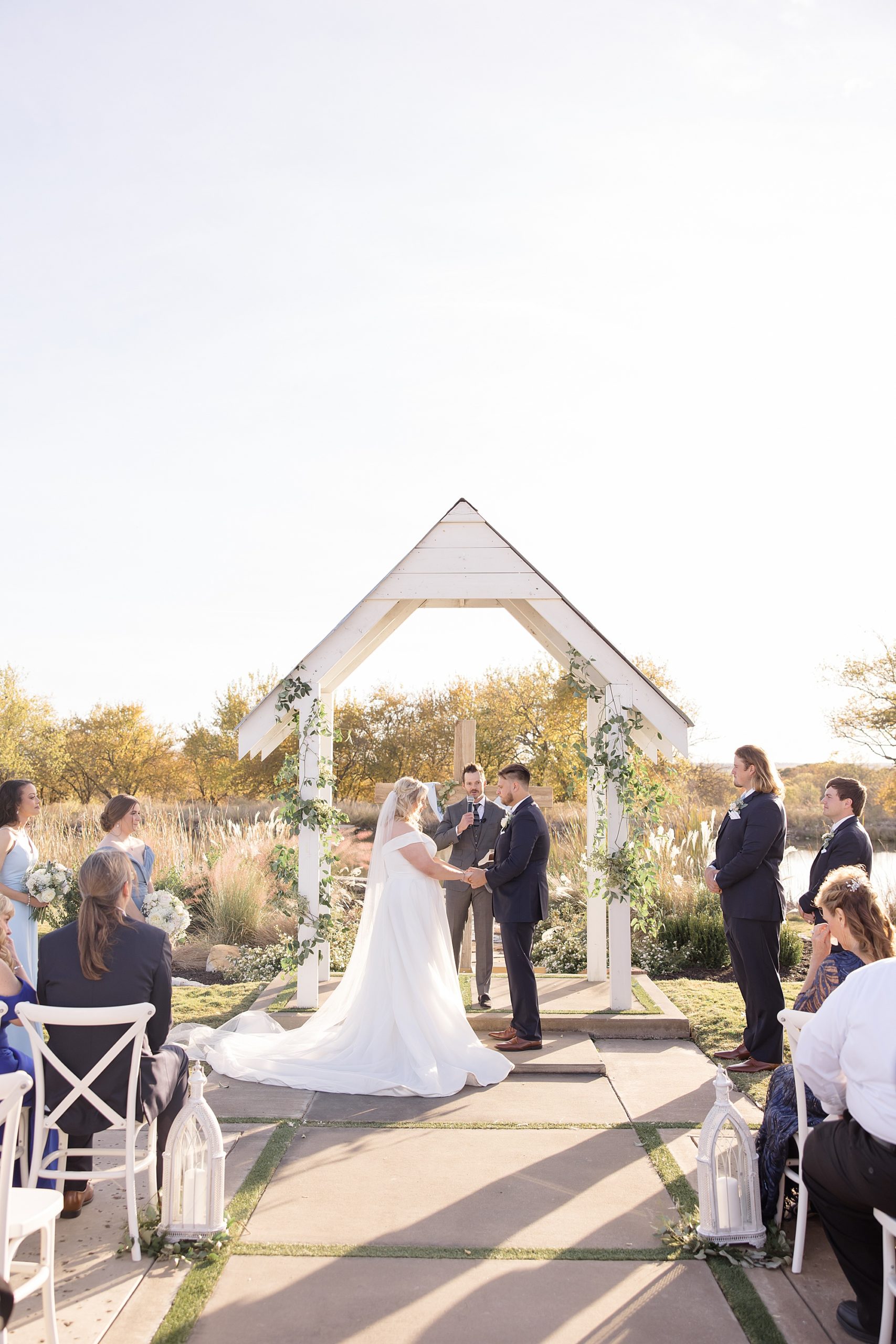 newlyweds exchange vows during outdoor wedding ceremony in Texas