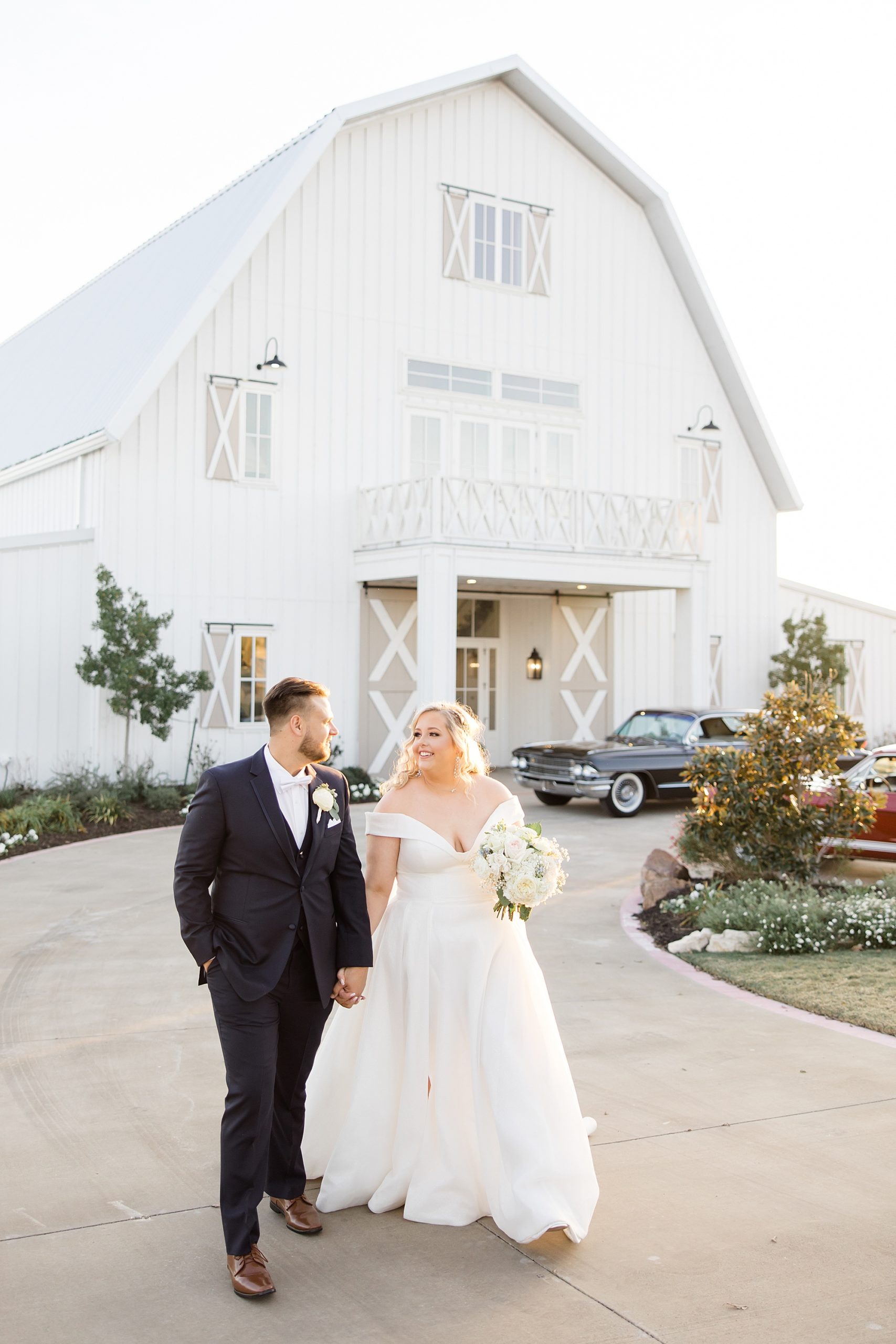 bride and groom walk outside the Nest at Ruth Farms