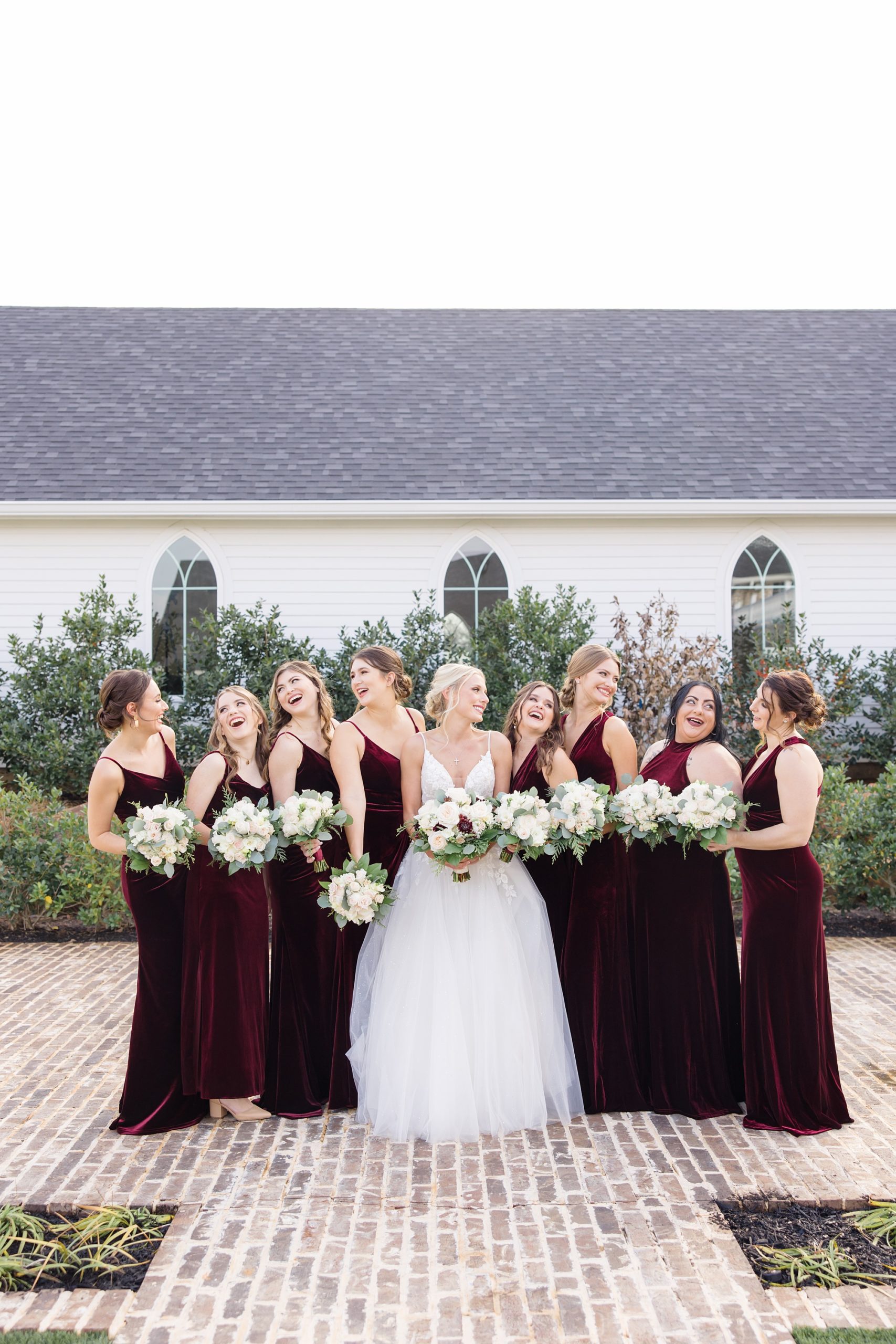 bride laughs with bridesmaids during The Springs at Valley View wedding photos
