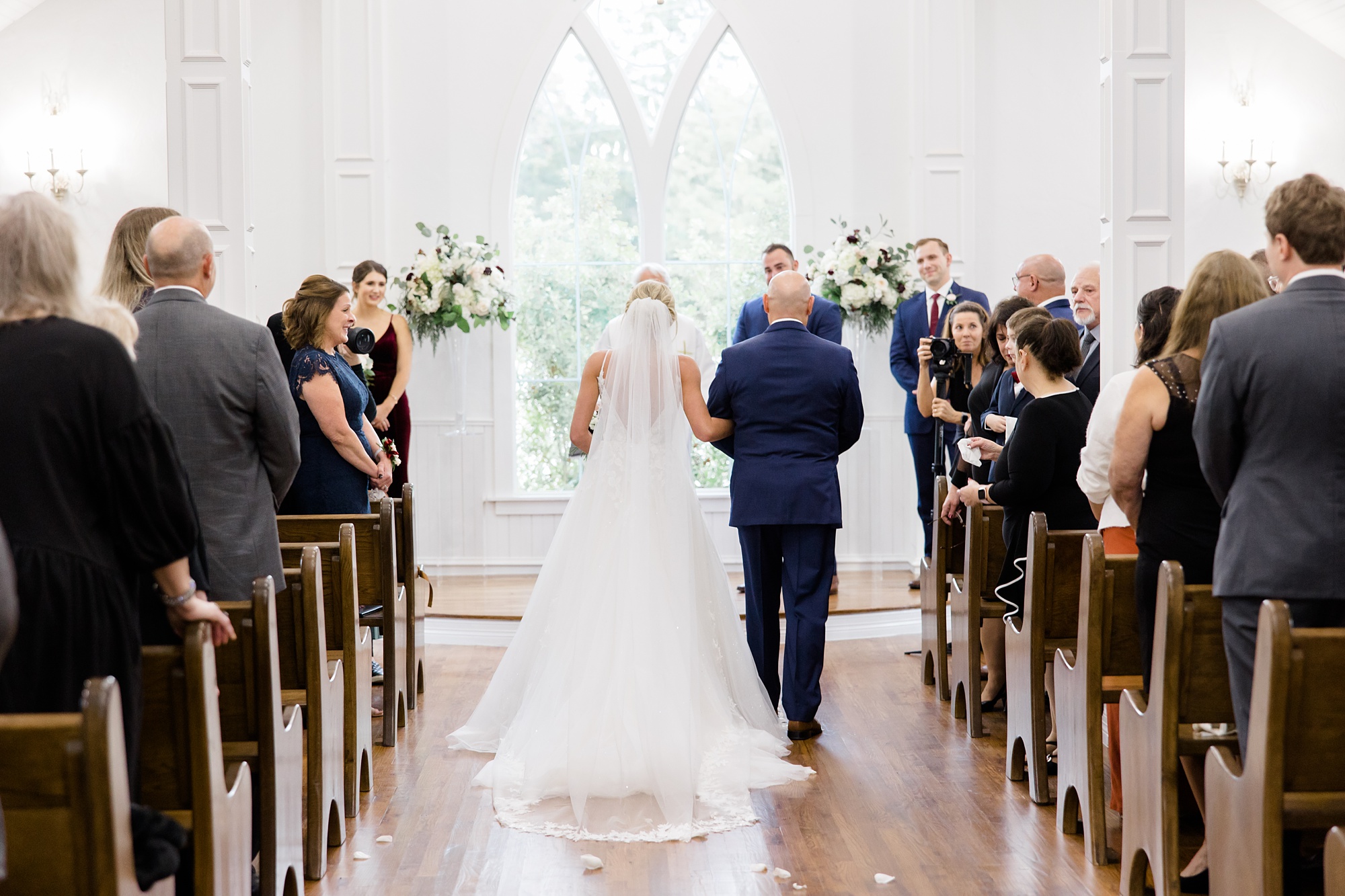 bride and dad walk down aisle before Valley View TX wedding ceremony