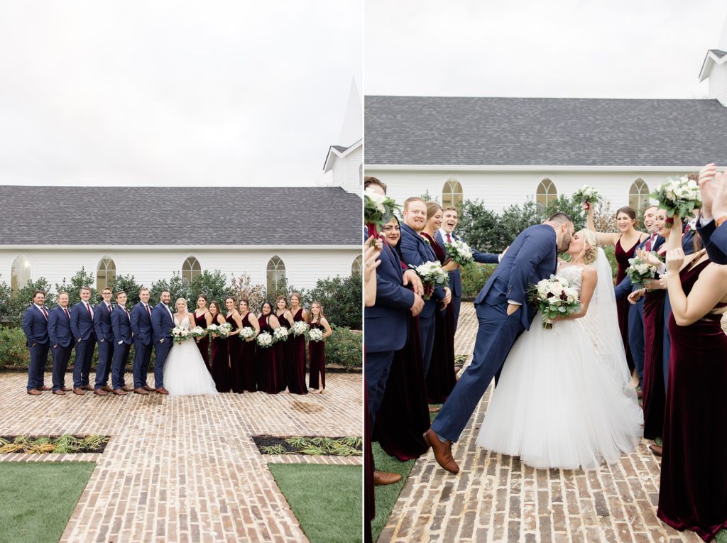 bride and groom kiss with wedding party cheering