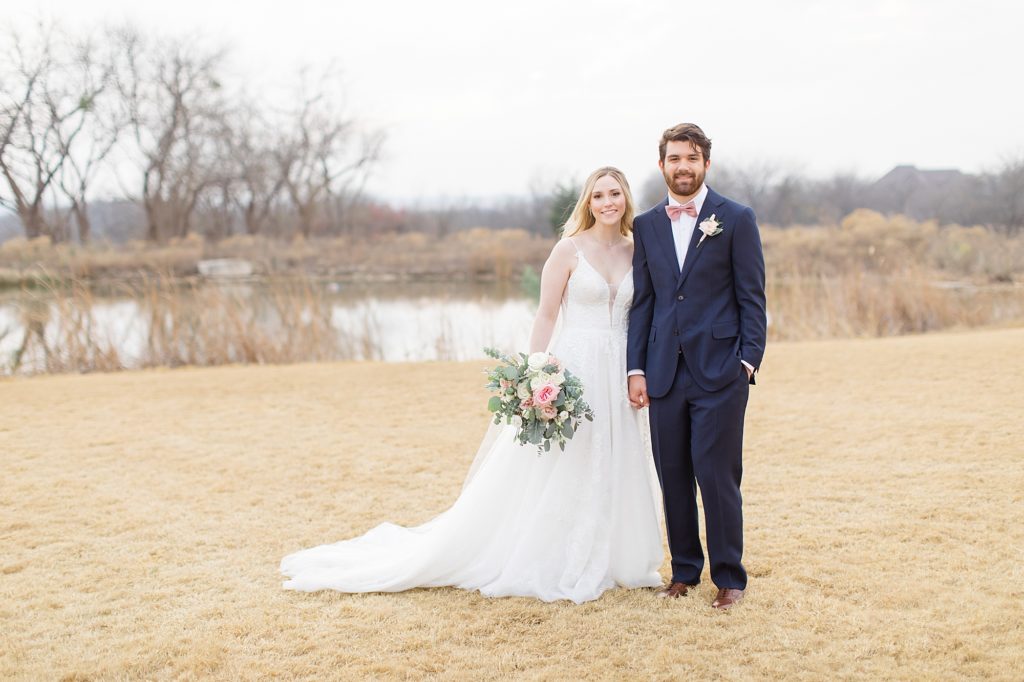 bride and groom stand together in Ponder TX