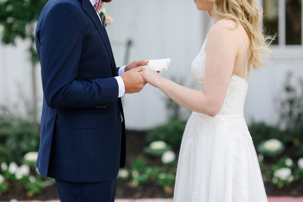 bride and groom read letters during first look