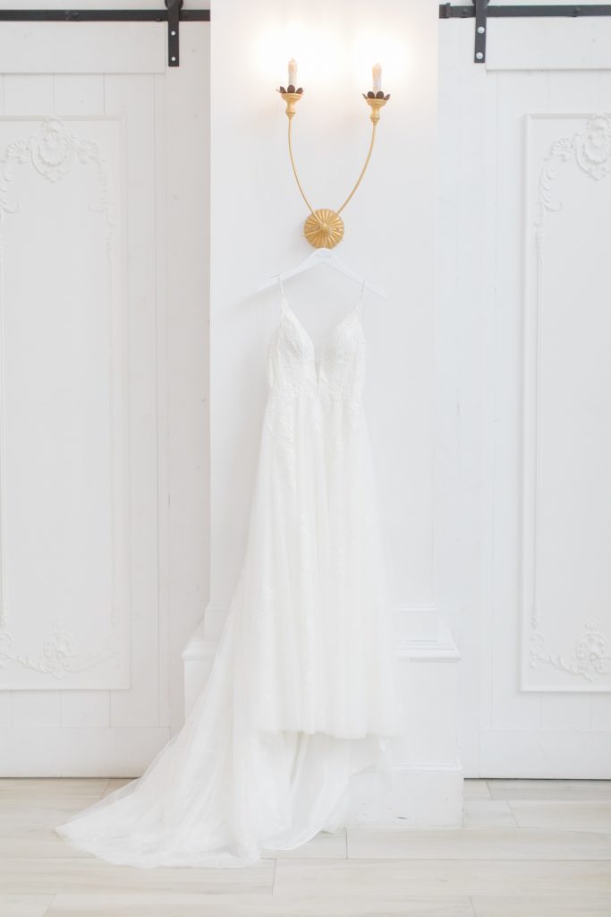 wedding dress hangs in bridal suite at The Nest at Ruth Farms