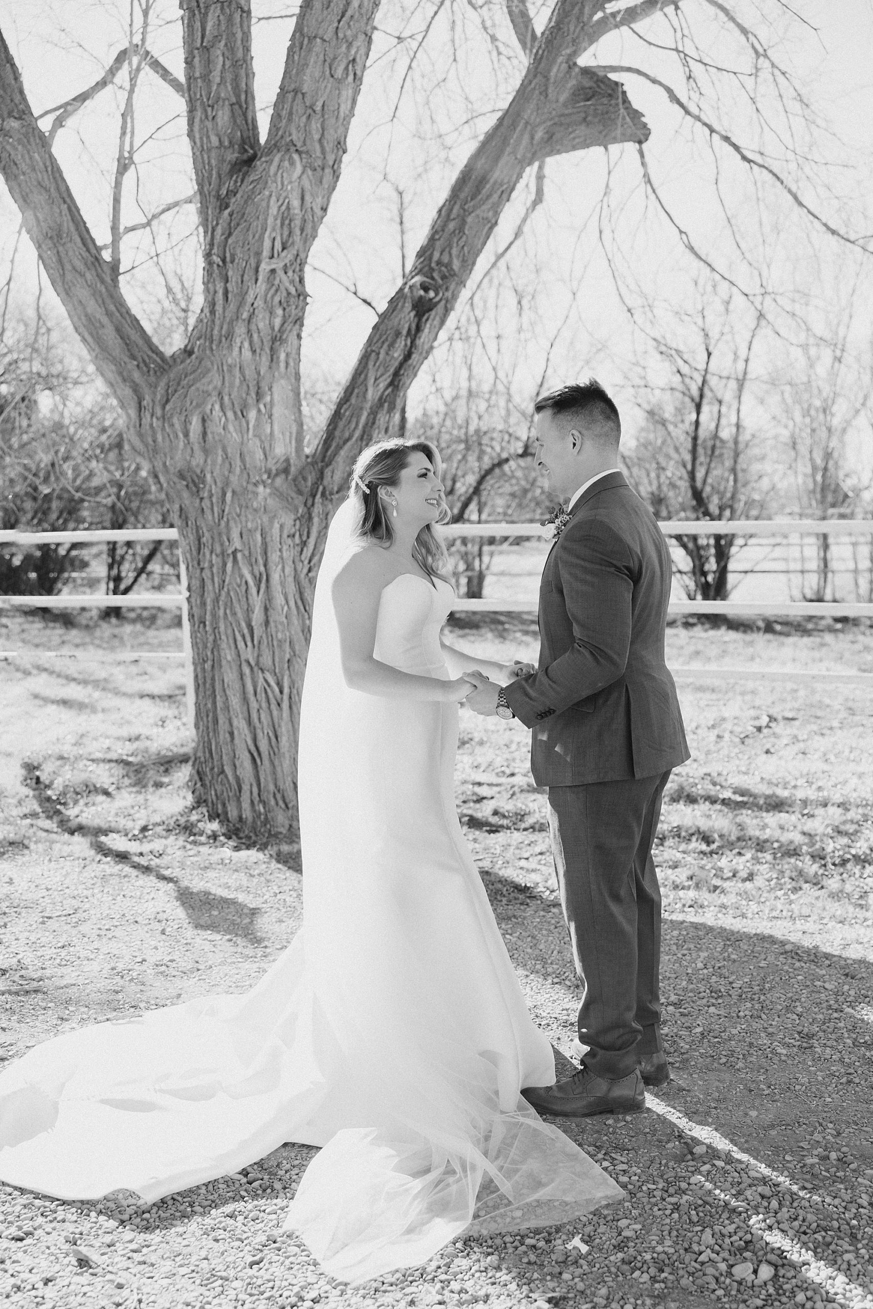 bride and groom see each other during first look before winter wedding day