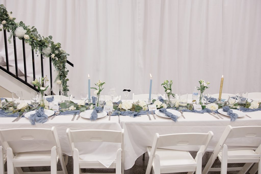 place settings with blue tapered candles at farm 