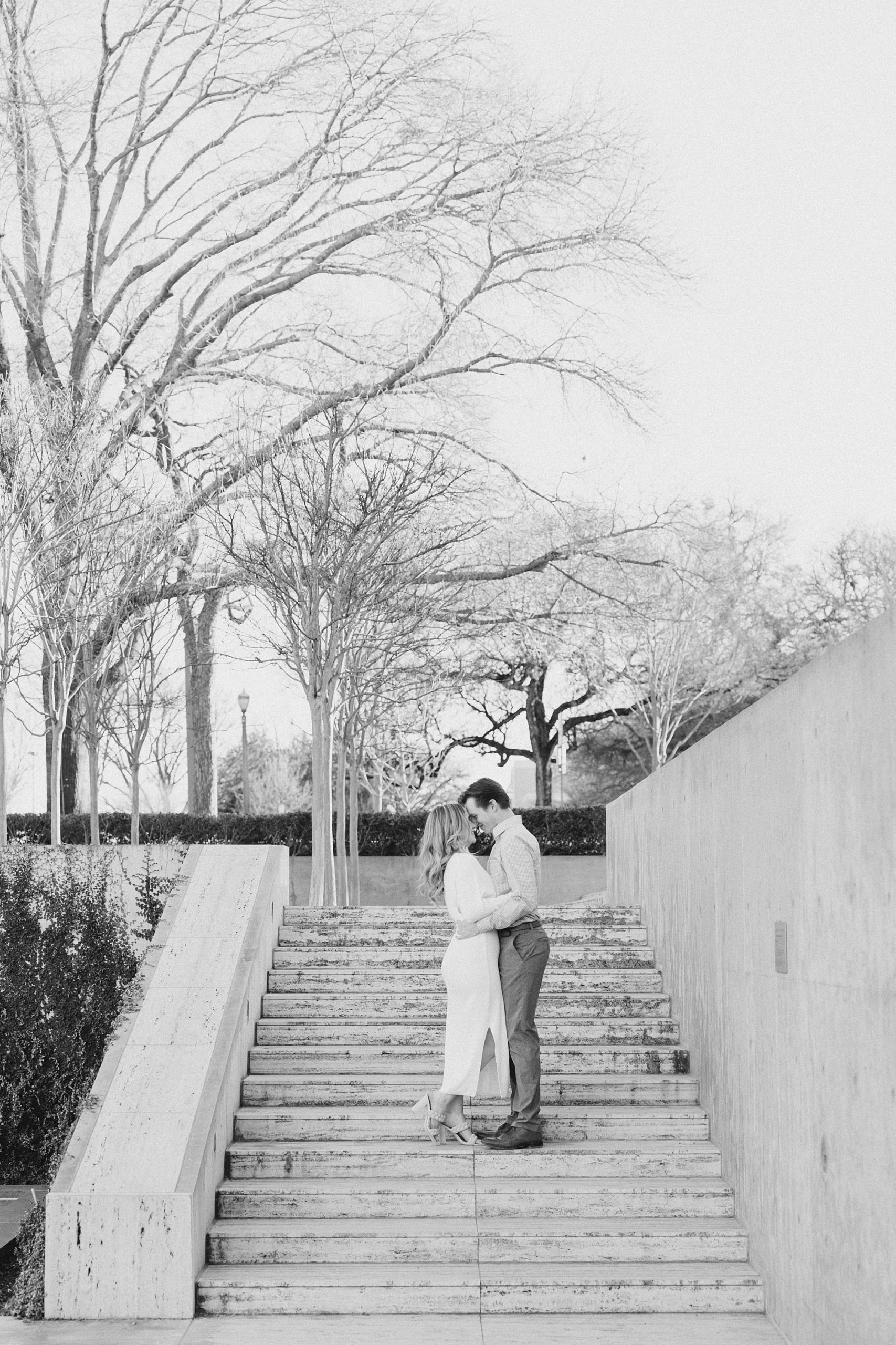 bride and groom stand on steps in Texas museum 
