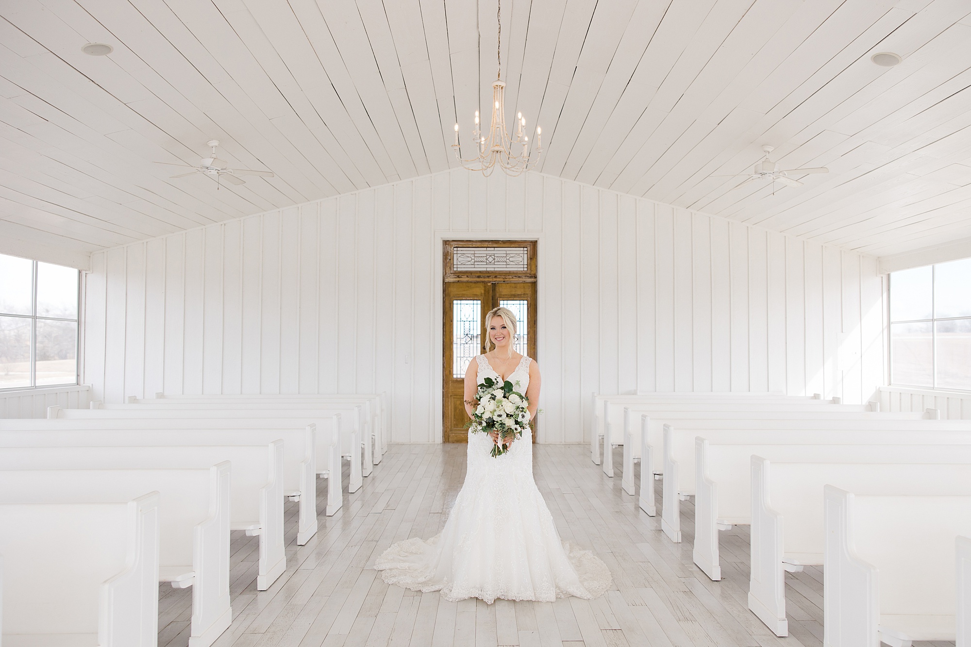 bride poses in chapel at The Grand Ivory