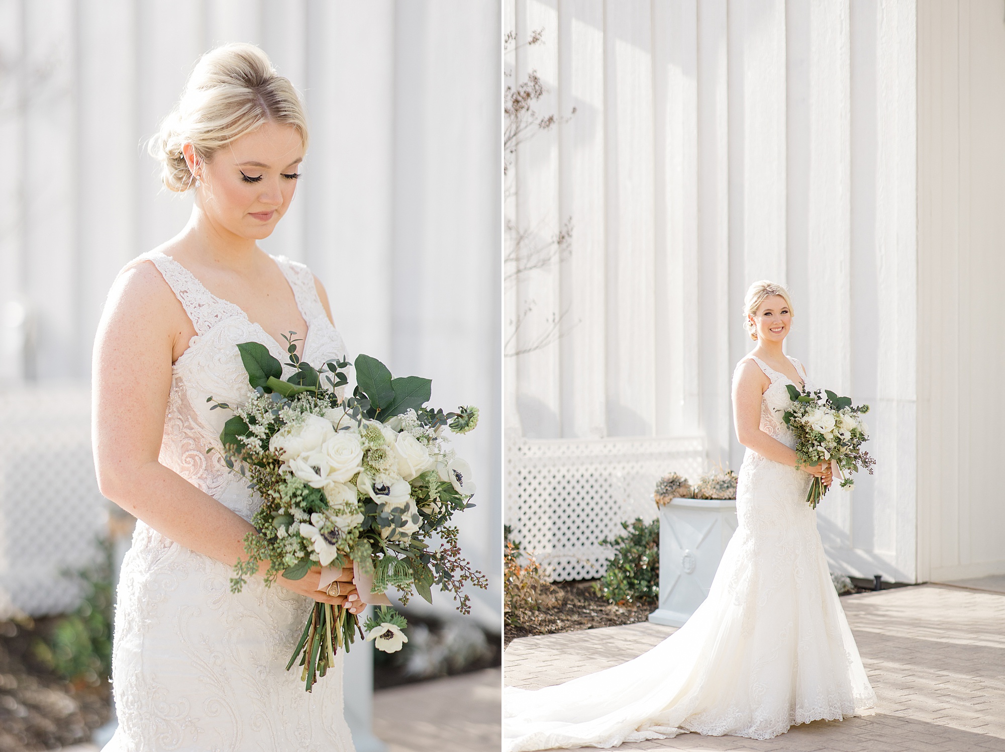bride looks down at bouquet of white flowers and green leaves 