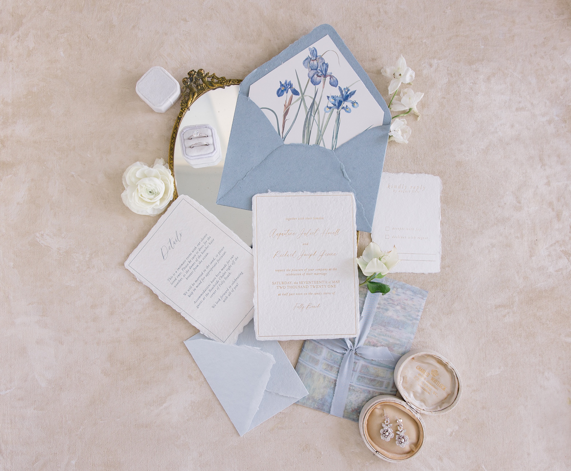 invitation suite with blue envelope and details