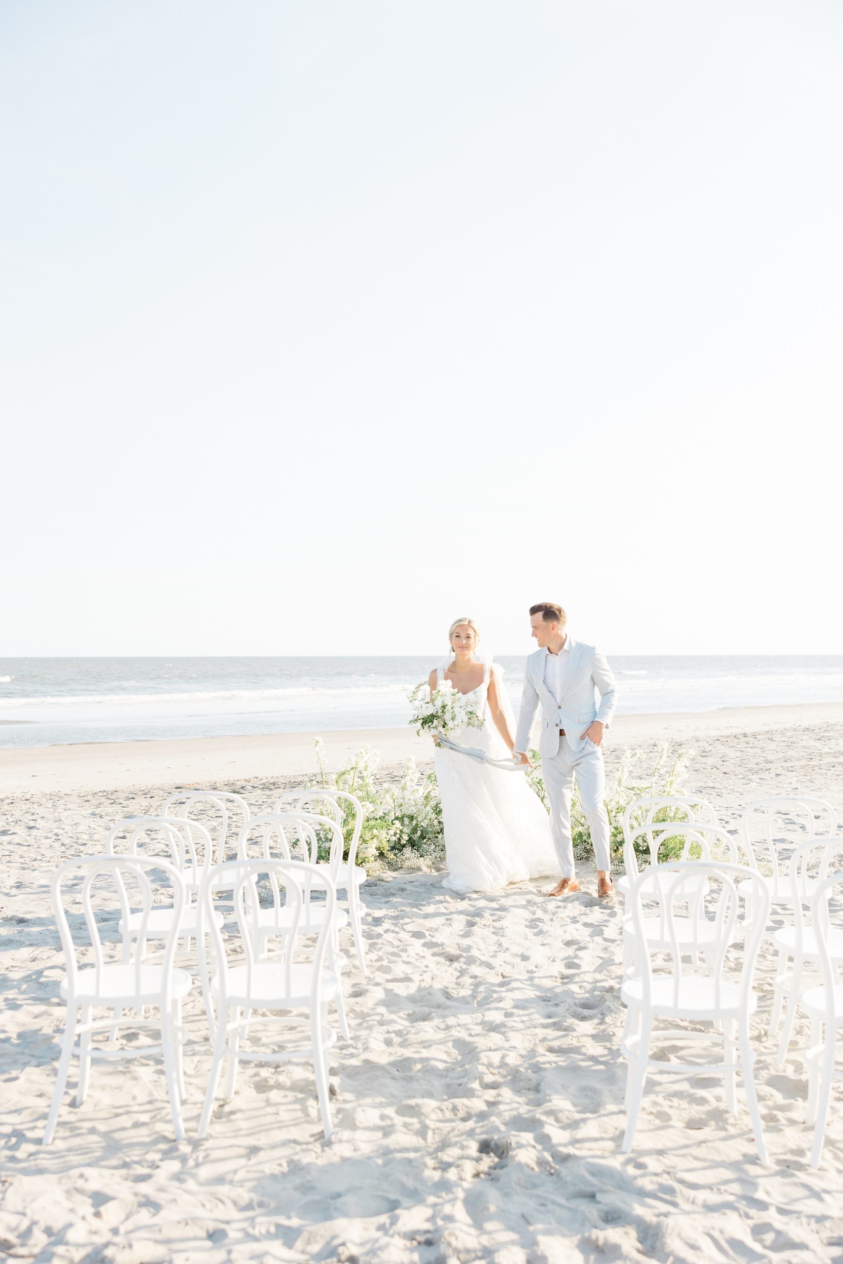 newlyweds walk up aisle on Folly Beach