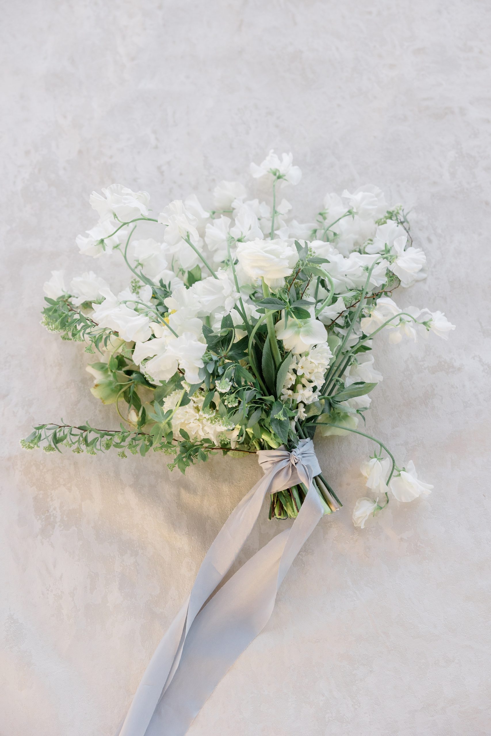 all-white bouquet for beach wedding day